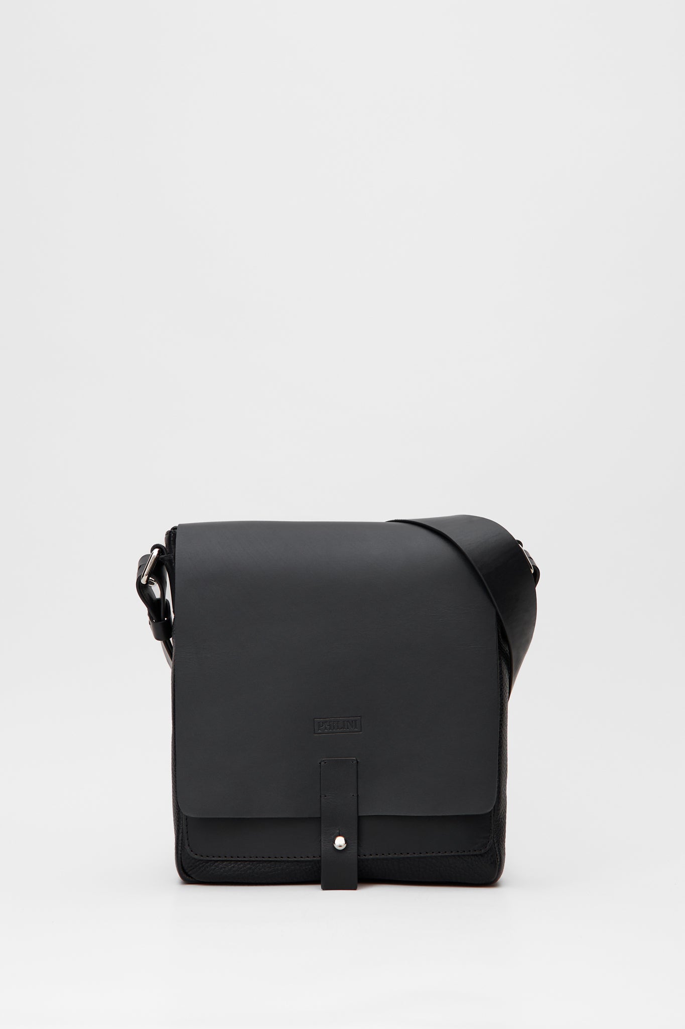 Black leather crossbody bag on a light gray background