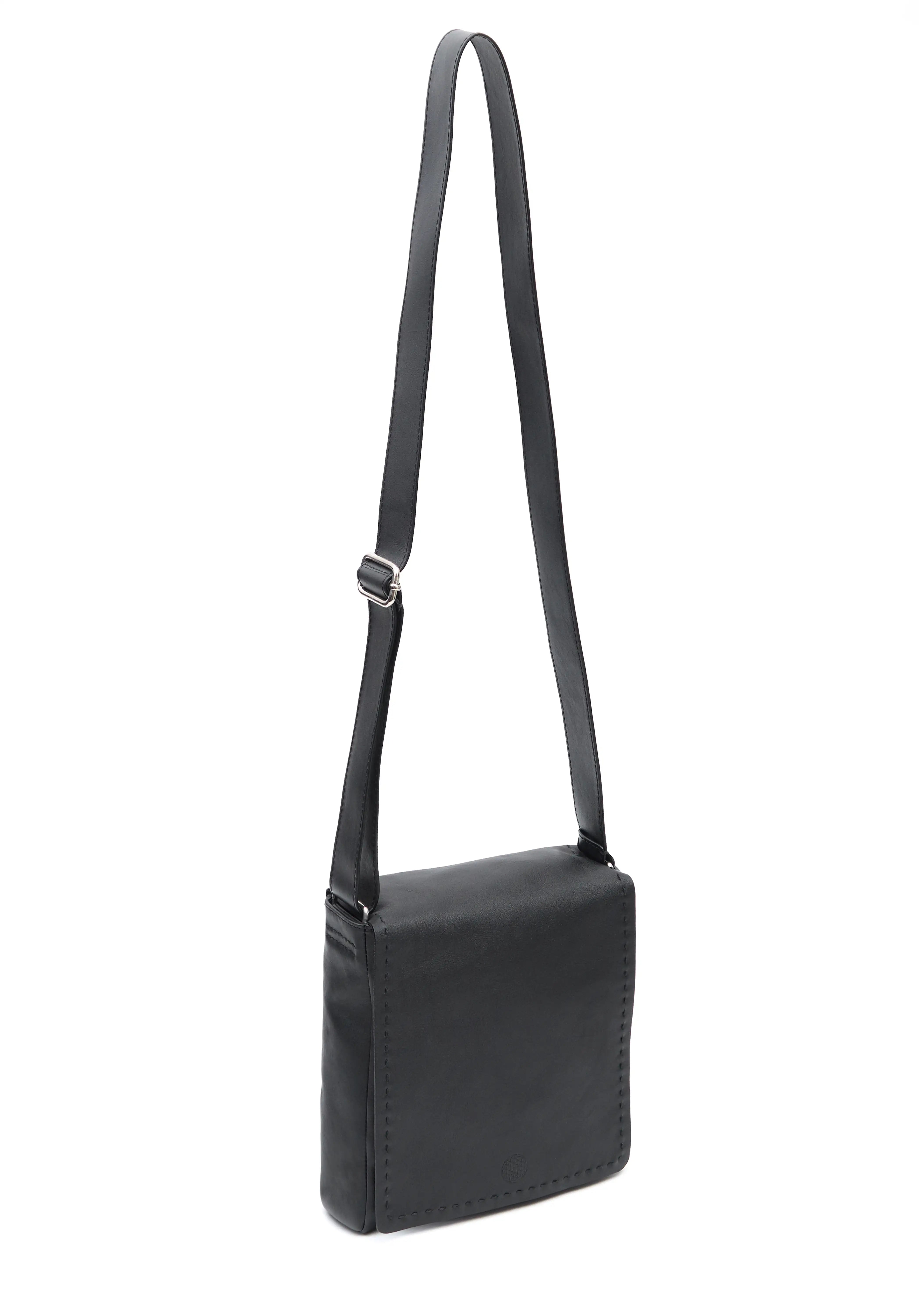 Side view of the Philini Anastasia Messenger Bag in black aniline nappa leather, featuring a structured square design, full front flap, and hand-stitches. Stylish black leather shoulder bag for everyday wear