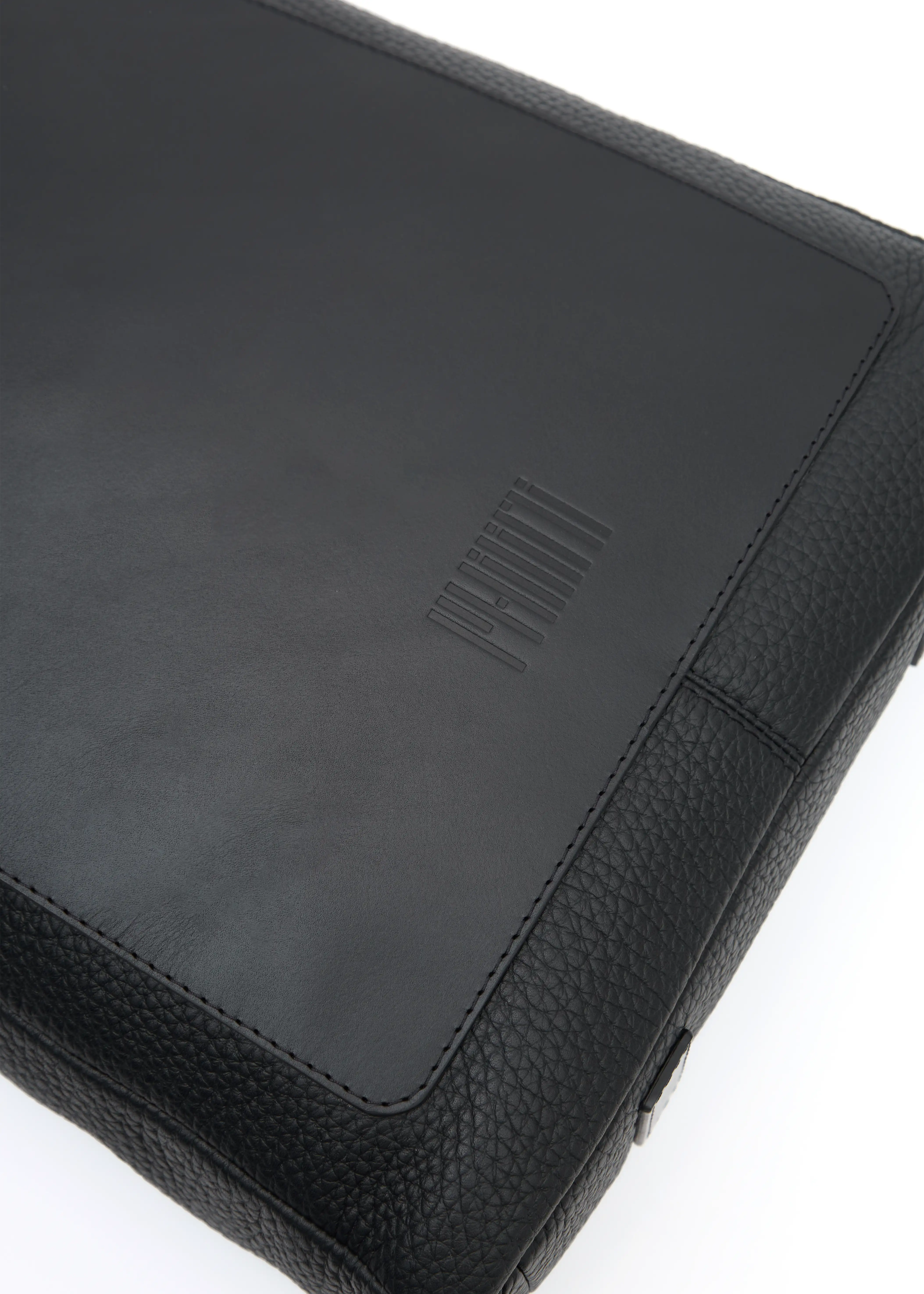 Close-up of the Philini Andrea Bag in Black – Showcasing the embossed Philini logo and the luxurious combination of buffalo and full-grain. This handcrafted tote bag highlights premium materials, timeless design, and exceptional craftsmanship.