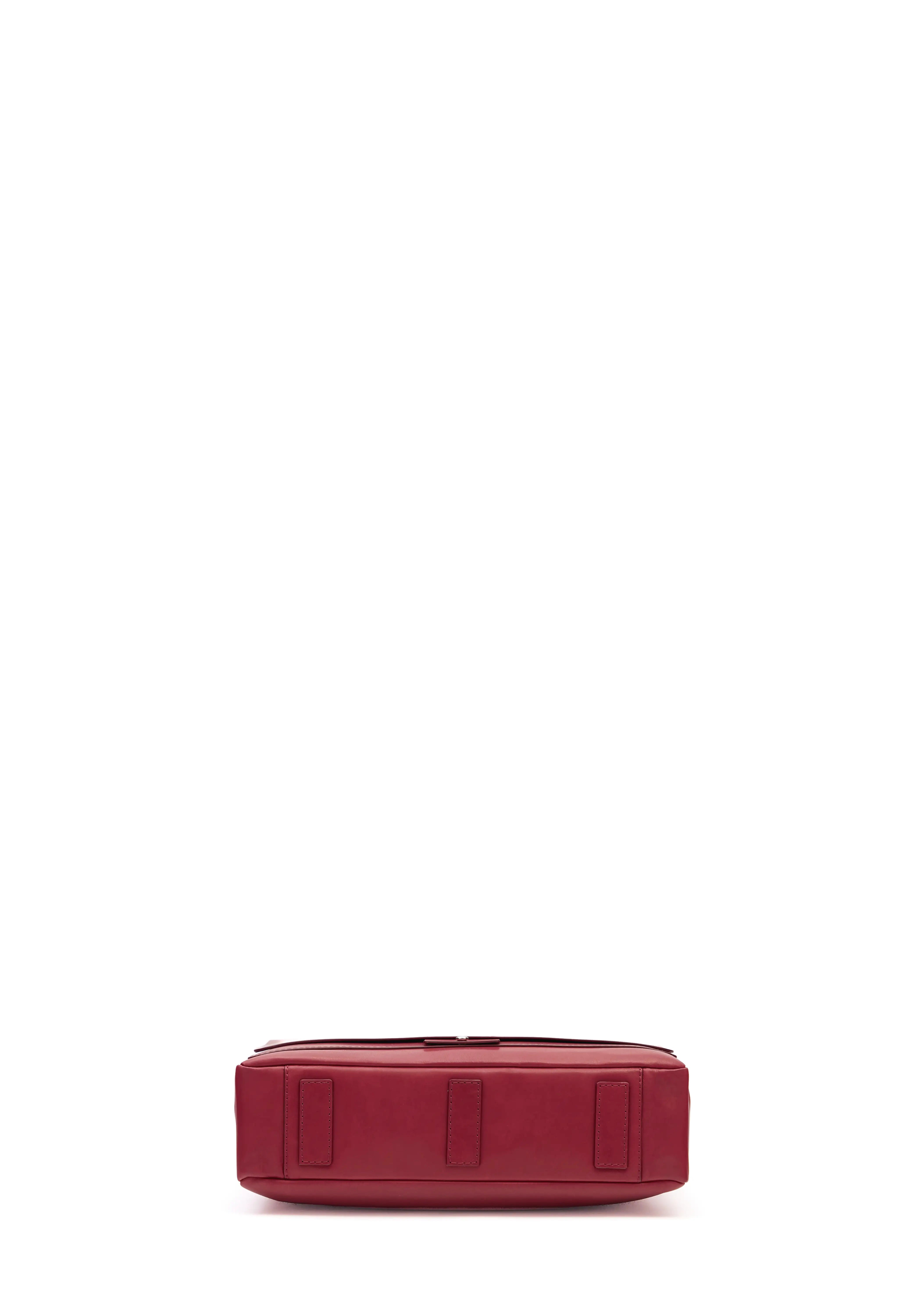 Bottom view of the Philini Aneta Bag in red, crafted from durable red aniline leather with two protective leather pads on the bottom. It is a handcrafted leather bag crafted from substantiale materials