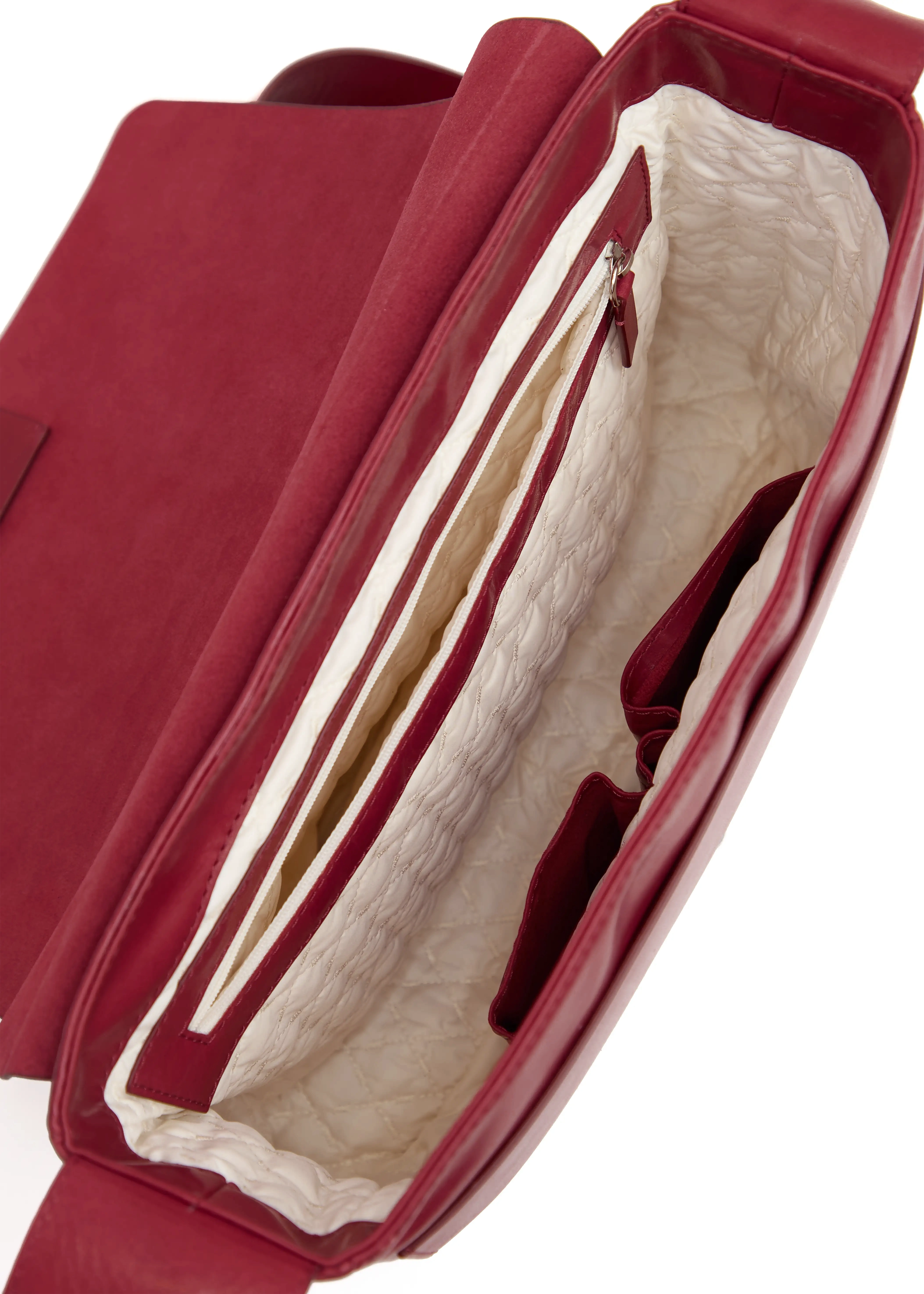 Inside view of the Philini Aneta Bag in Red, featuring two compartments: a solid leather pocket with silver details, a zippered deep pocket, and two leather mobile phone compartments. It all lined with a vanilla-colored soft lining.