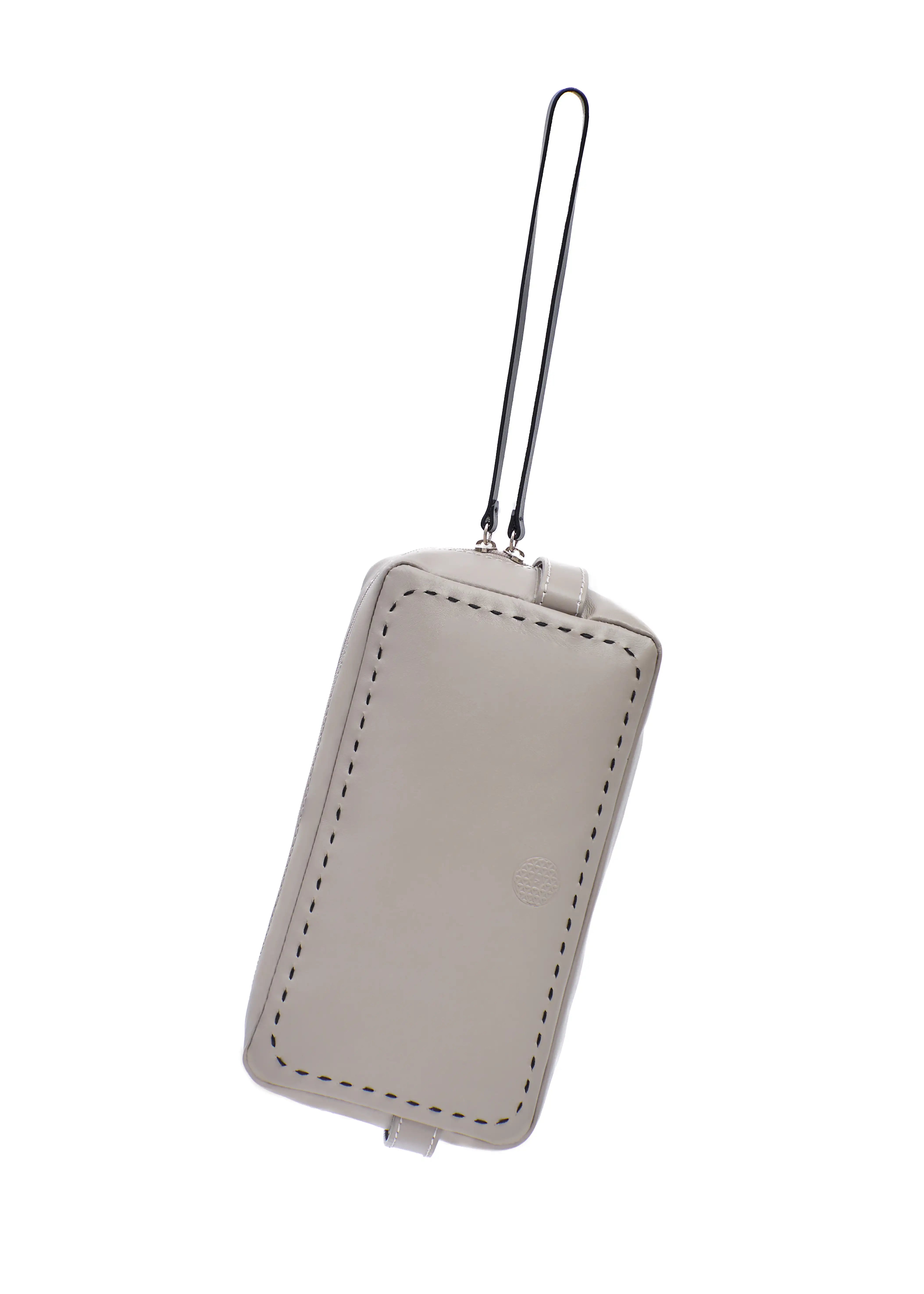 Front view of the Philini Magdalena taupe leather pouch with rectangular shape. Minimalist leather cosmetic bag, elegant small leather accessory.
