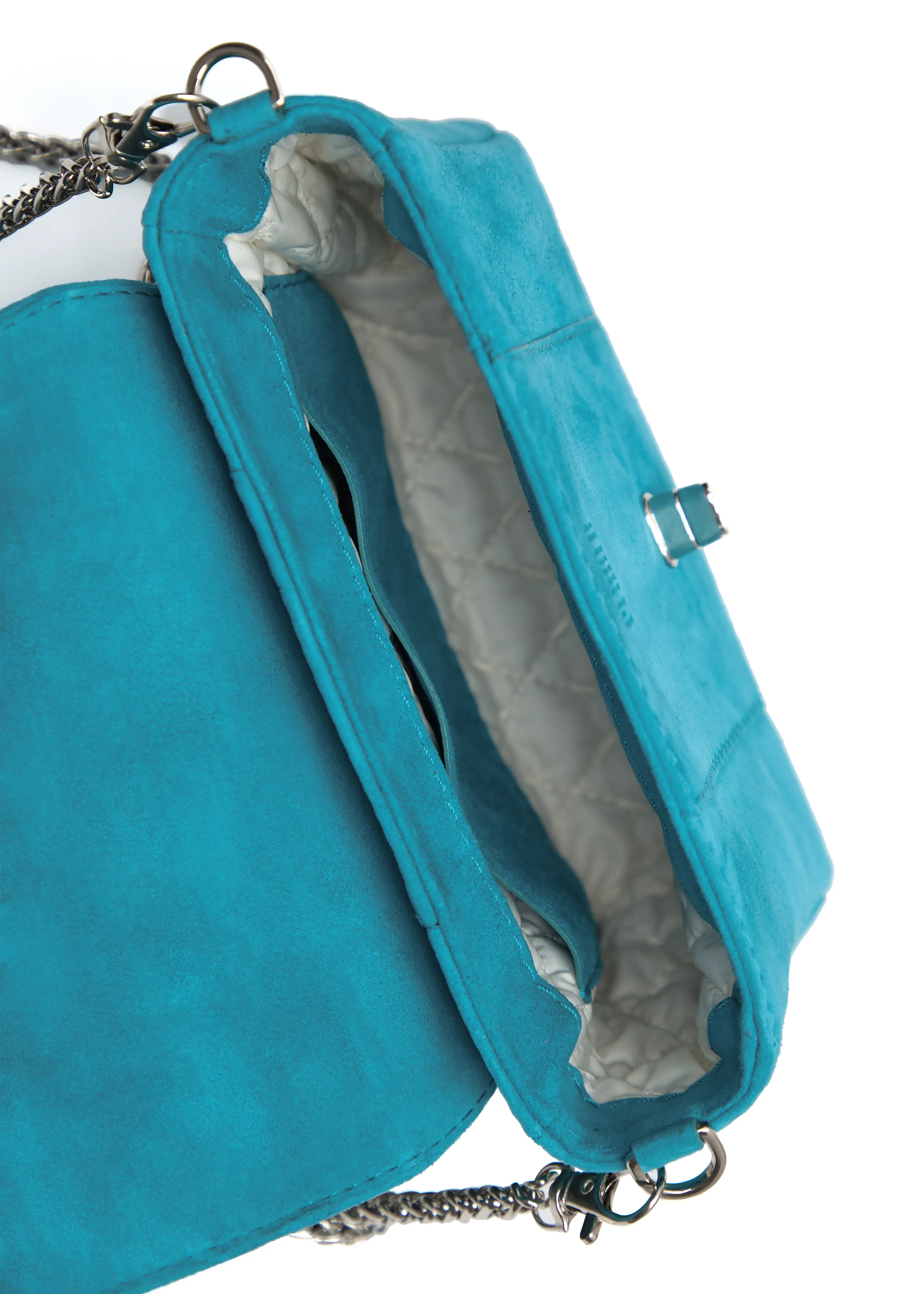 Inside view of the Philini Marina Mini Crossbody Bag in turquoise suede leather, showing open flap with silver clasp, chain with carabiner attachments, stitched vanilla lining, open compartment, inner pocket, and stamped logo.