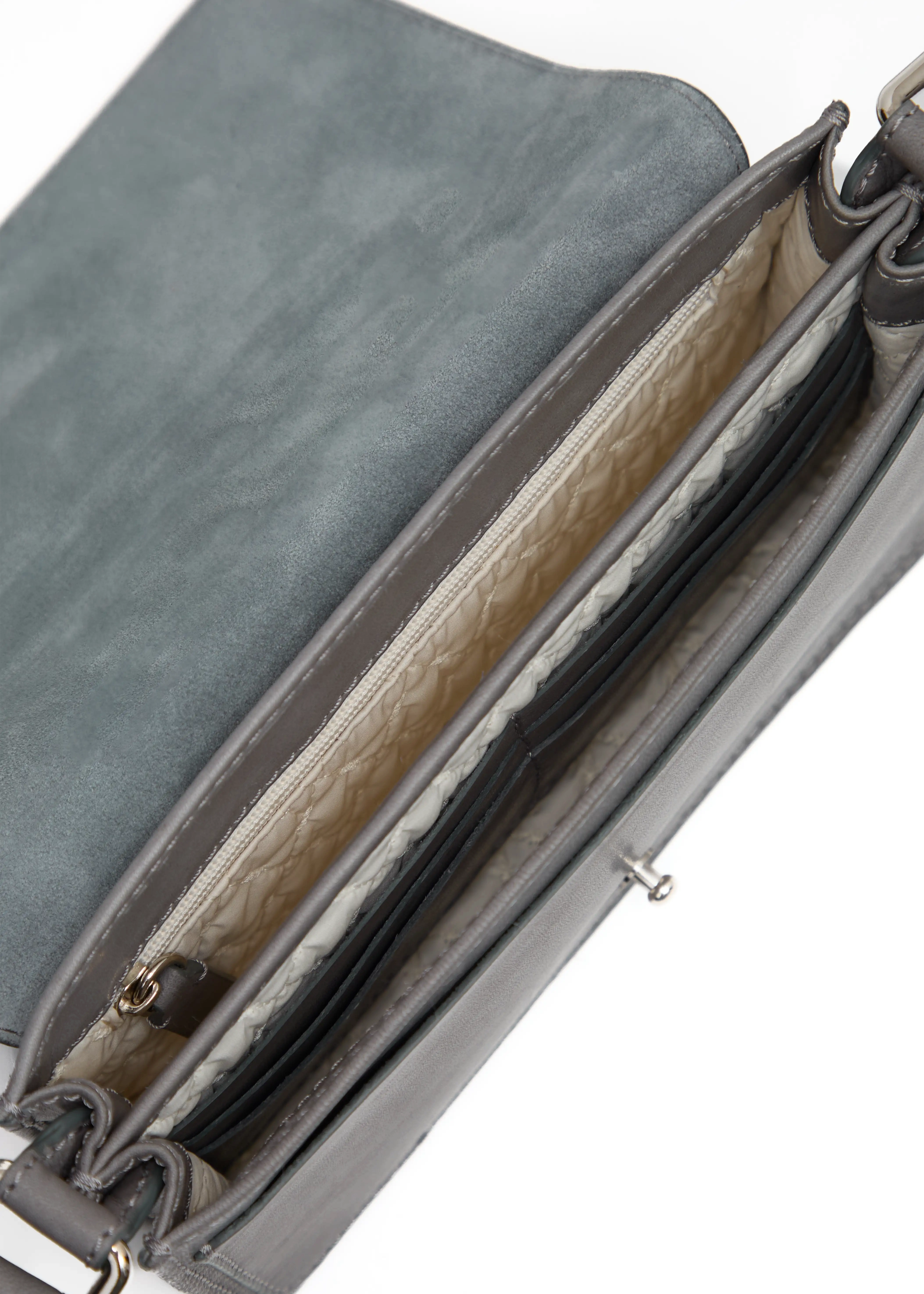 Close-up interior view of the Philini Mihaela Grey Wallet Bag, showcasing a light fabric lining, 3 compartments including a flat leather pocket with a push button, leather card slots, and a zippered pocket. A handcrafted, luxury crossbody wallet