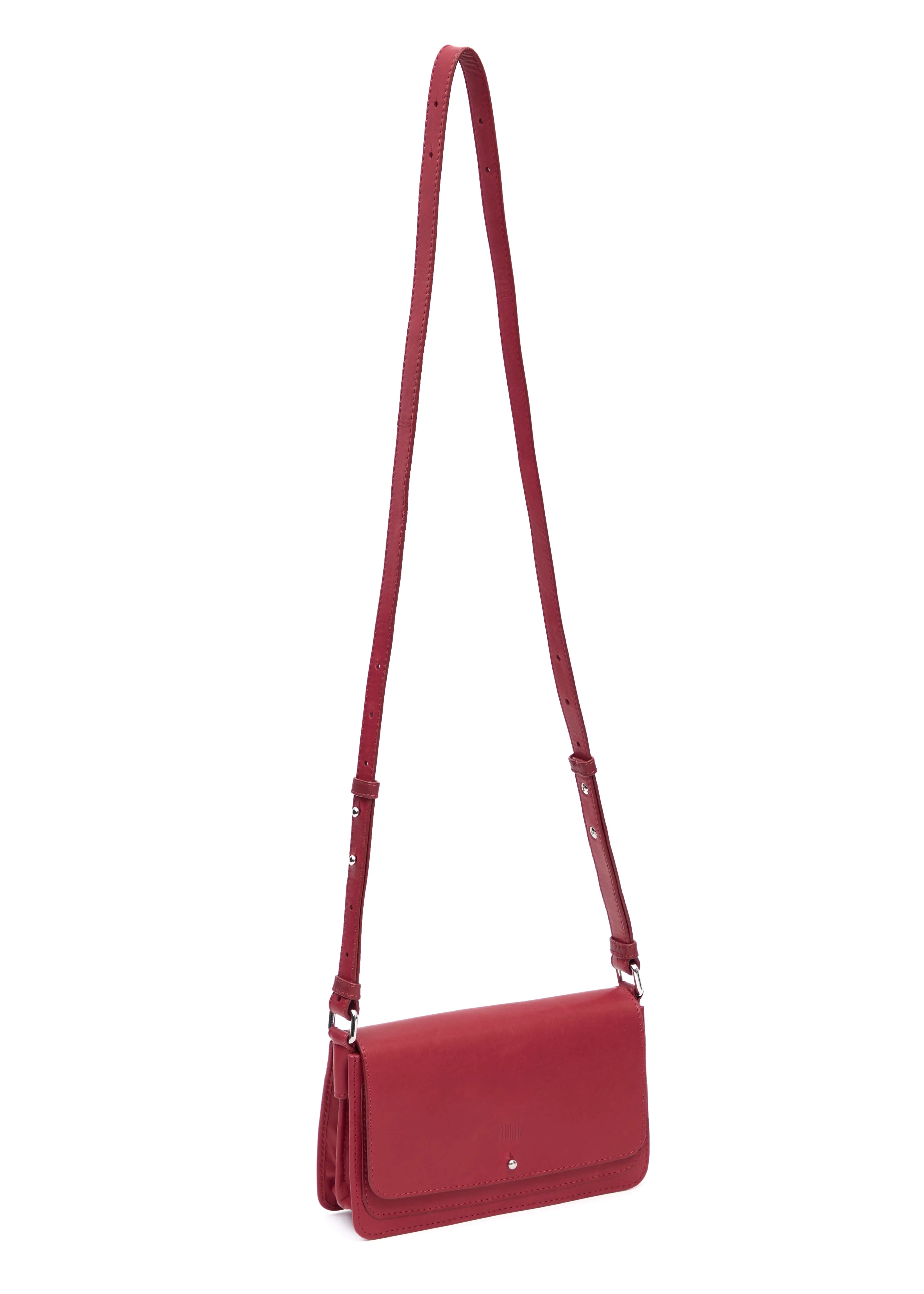 Side view of the Philini Mihaela Wallet Bag in red Nappa leather, featuring a rectangular silhouette, front flap with silver cufflink closure, accordion sides, and an adjustable leather strap with silver details. A wallet crossbody, perfect for luxury and elevated everyday style