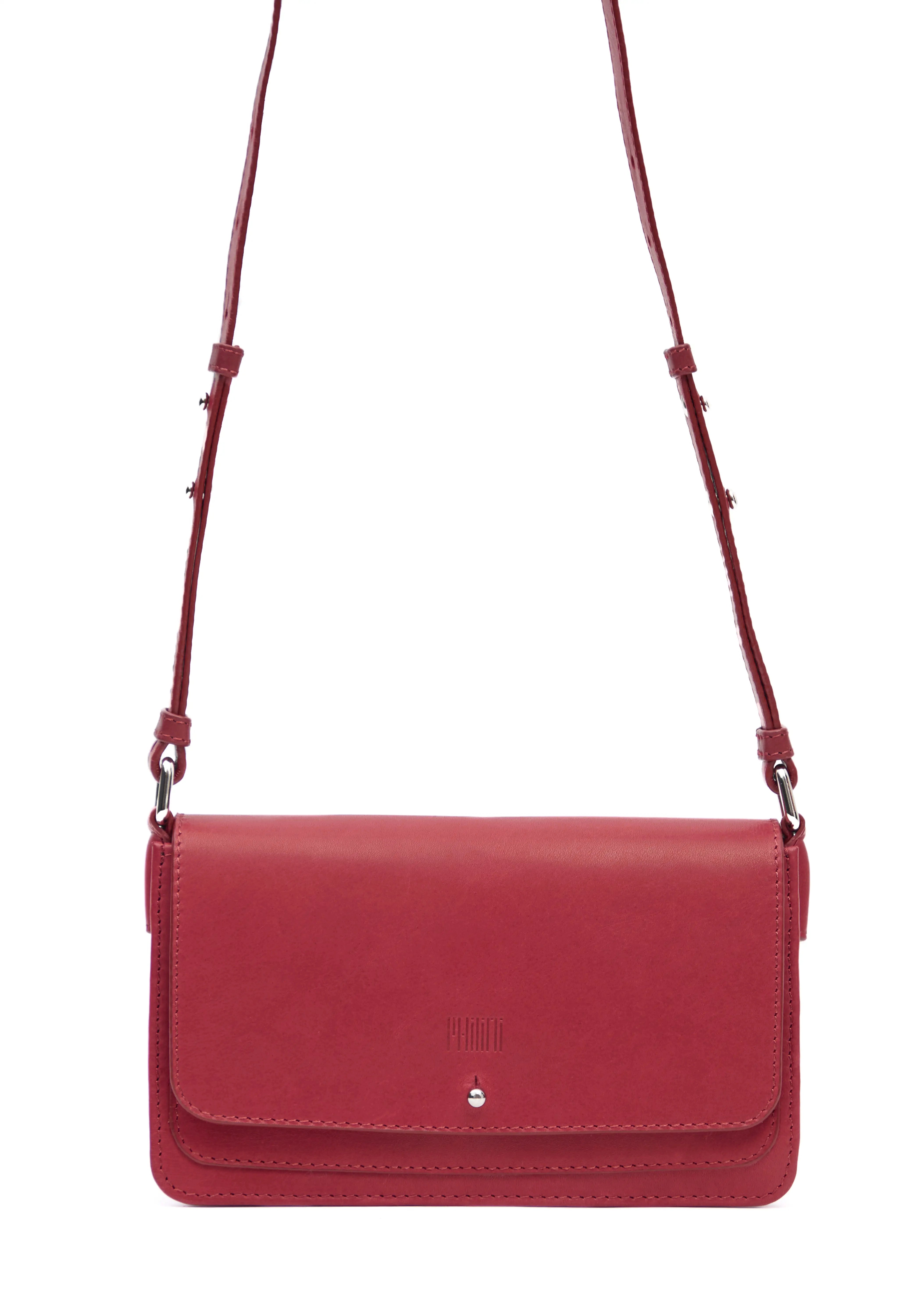 Close-up front view of the Philini Mihaela Wallet Bag in red Nappa leather, featuring a rectangular shape, front flap with silver cufflink closure, adjustable leather strap with silver accents, and a stamped logo. This minimalist wallet crossbody blends conscious luxury with timeless leather craftsmanship