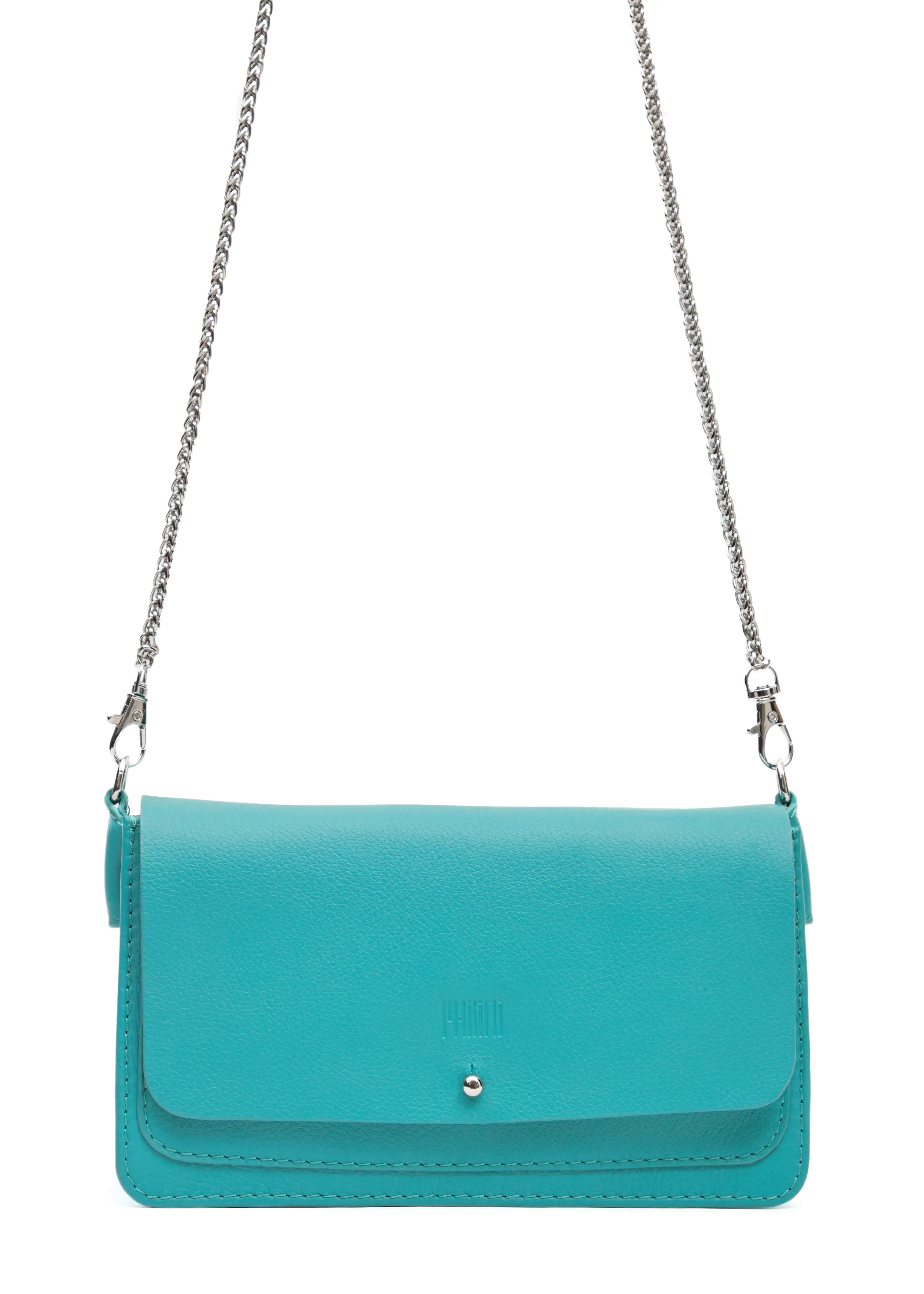 Close-up front view of the Philini Mihaela Wallet Bag in turquoise nappa leather, showing the rectangular shape, front flap with silver cufflink closure, stamped logo, and silver chain handle with carabiners. A compact, handcrafted designer wallet bag for conscious luxury and slow fashion.