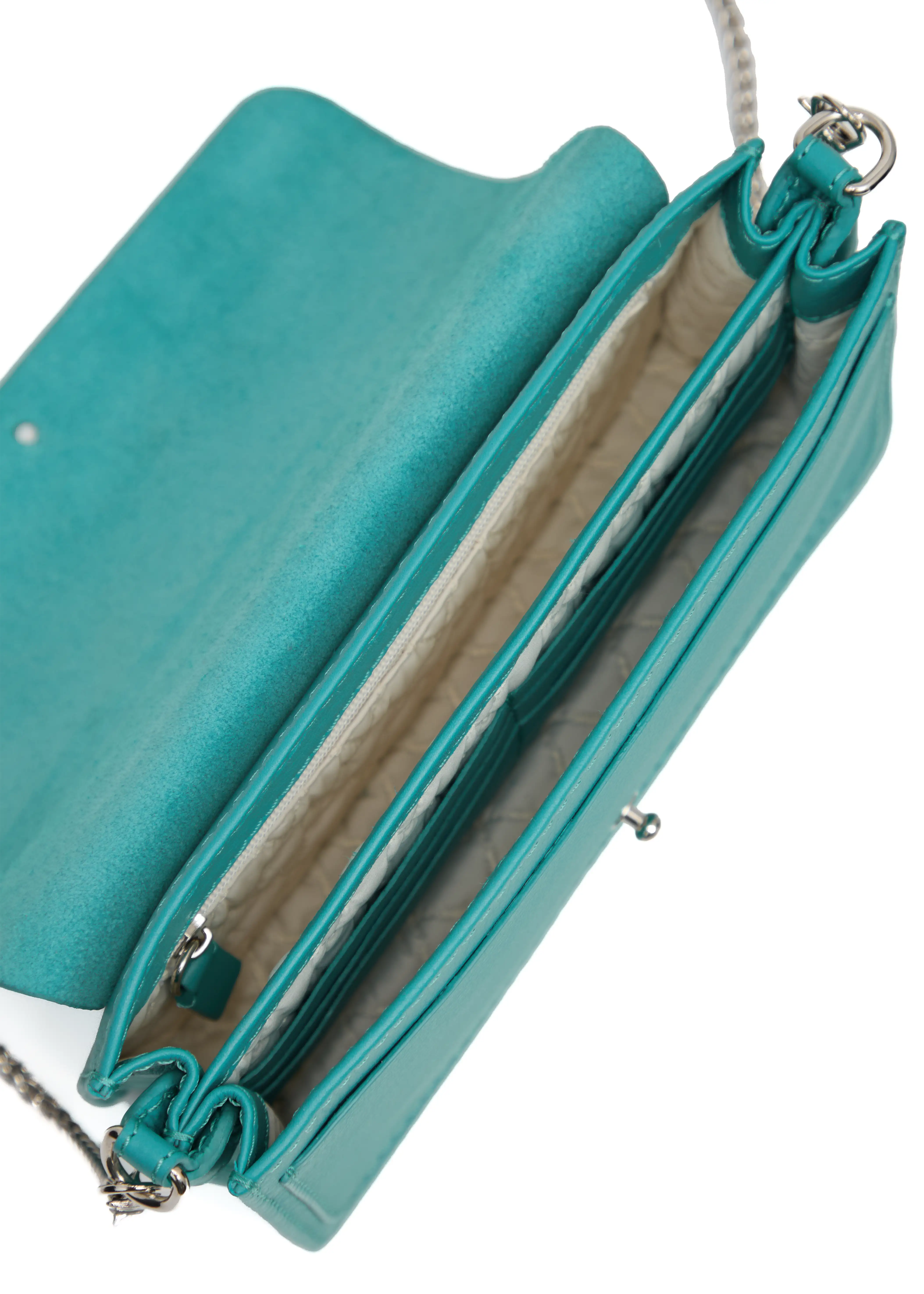 Close-up interior view of the turquoise Philini Mihaela Wallet Bag in soft nappa leather, featuring a fabric-lined interior with multiple compartments, card slots, a zip pocket, and a silver chain strap — a handcrafted luxury wallet crossbody for refined