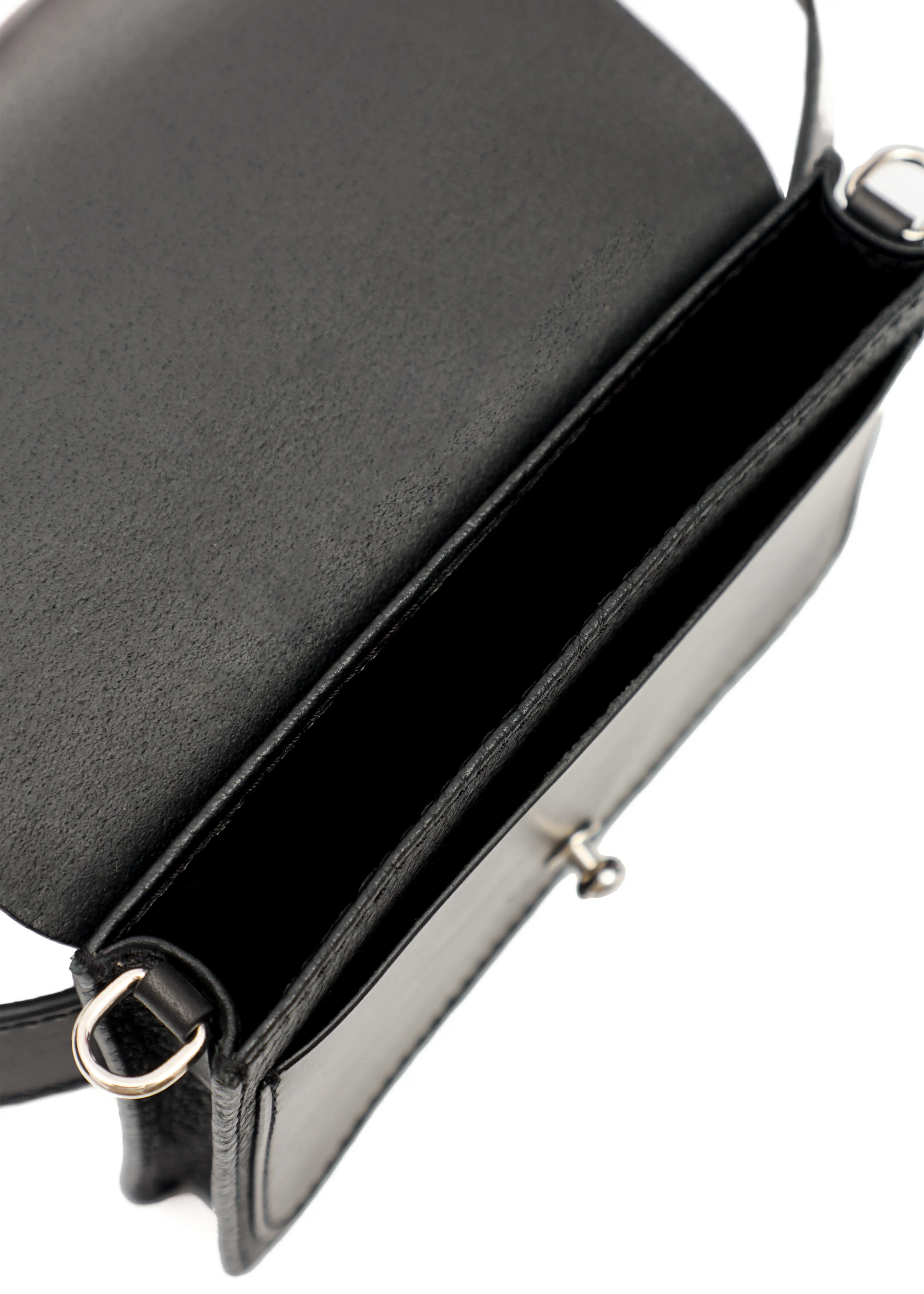 Close-up interior view of the Philini Polina Black Belt Bag, showcasing a dedicated compartment, a front pocket, and attachment details for a short handle. A luxury handcrafted leather bag made from premium materials