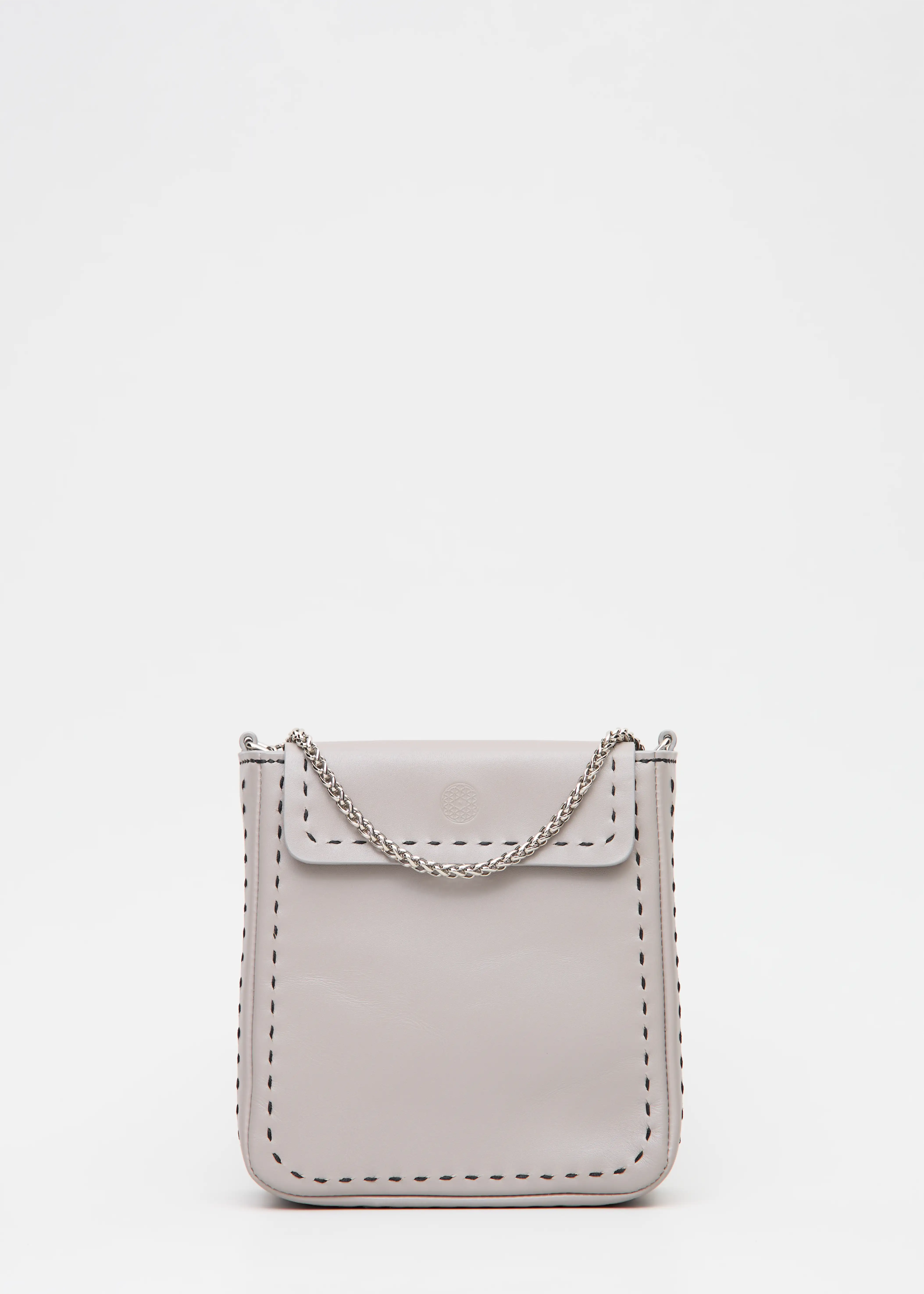 Close front view of the Philini Saphira Purse in taupe aniline leather, compact rectangular shape with hand-stitched details, sleek half-lap flap, and convertible chain and leather straps. Elegant handmade leather evening purse.
