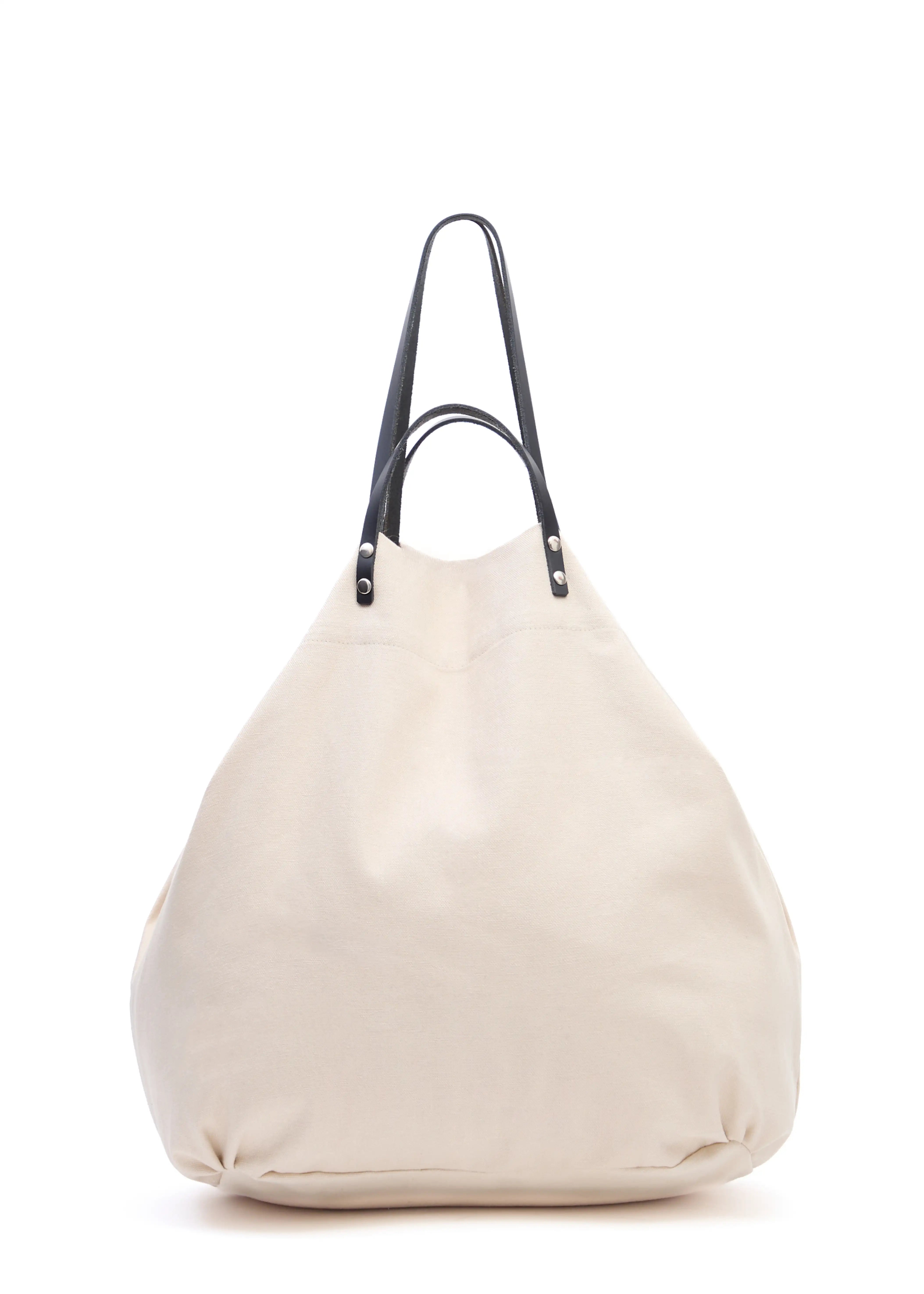 Back view of the Cream Philini Shopper in cotton, featuring both short and long leather handles with silver hardware and a clean top closure. Stylish handcrafted shoulder bag.
