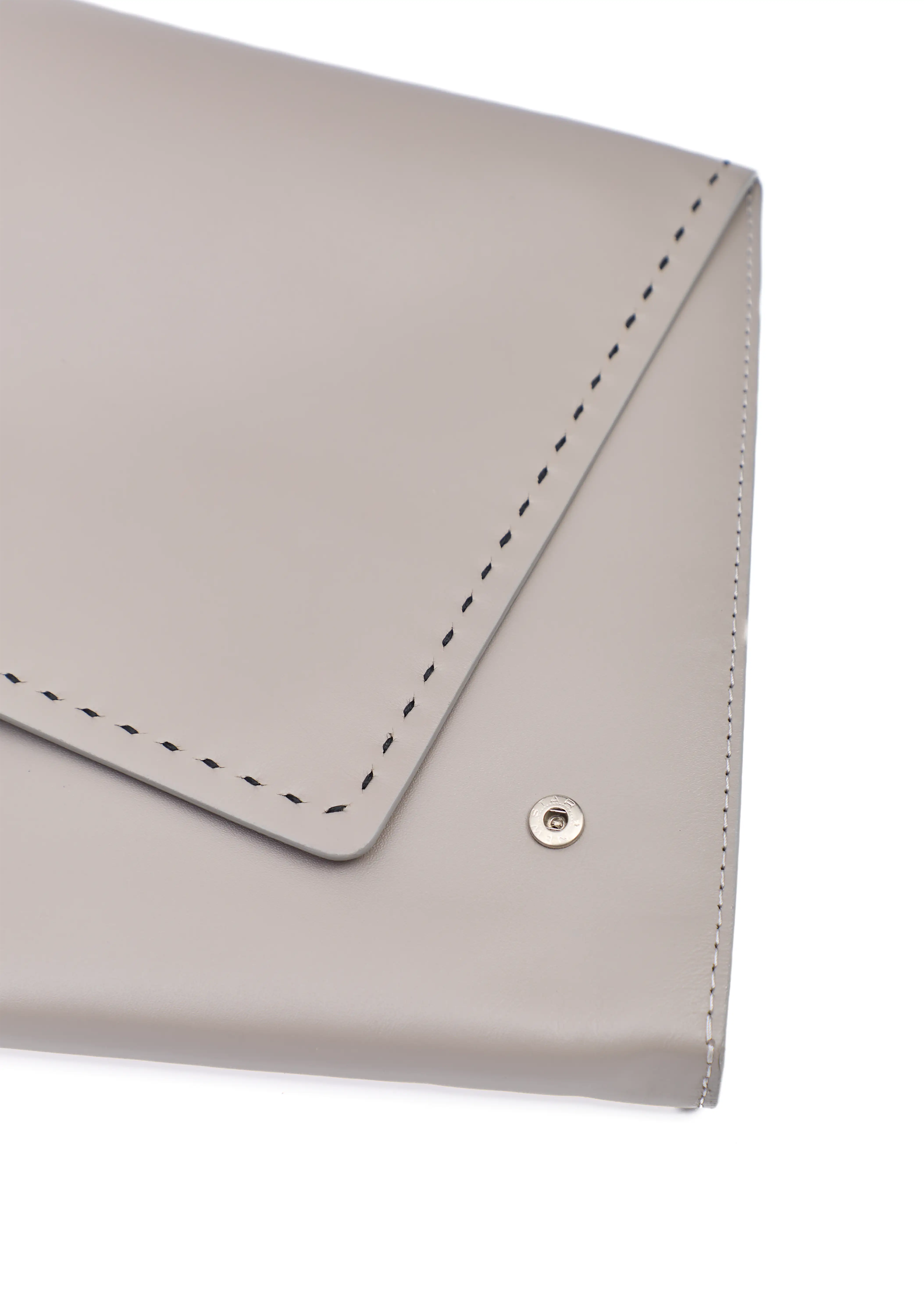 Close front view of the Philini Valery Business Clutch in taupe aniline nappa leather, slim rectangular shape, front flap slightly open with press studs and visible hand-stitched details.  Handcrafted leather accessory designed as an elegant leather case for work essentials