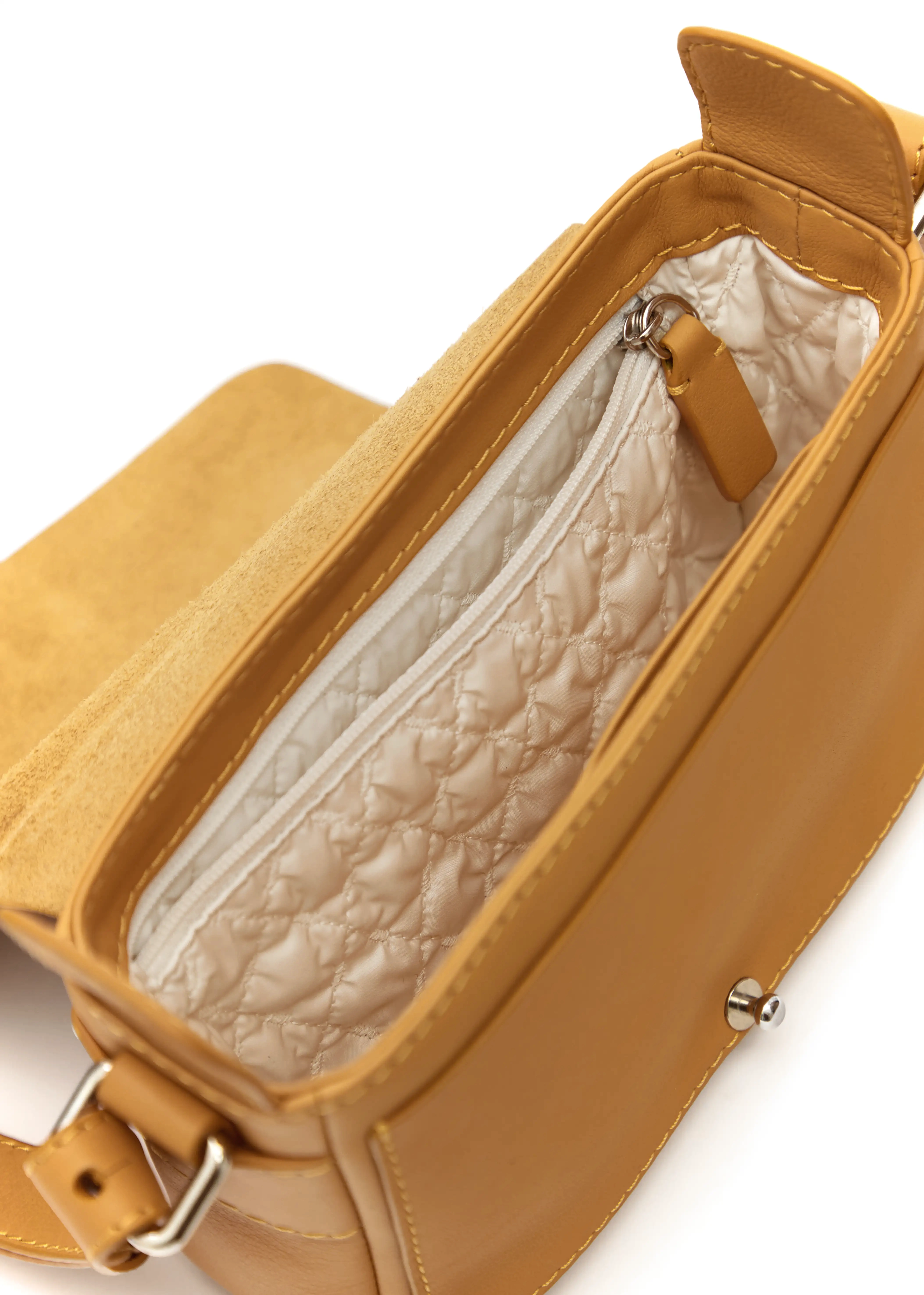 Inside view of the Philini Whitney Mini Crossbody Bag in turquoise nappa leather, showing the main compartment, zip pocket, leather phone slot, light lining, and leather structure plates at the opening. A compact, handcrafted mini leather crossbody