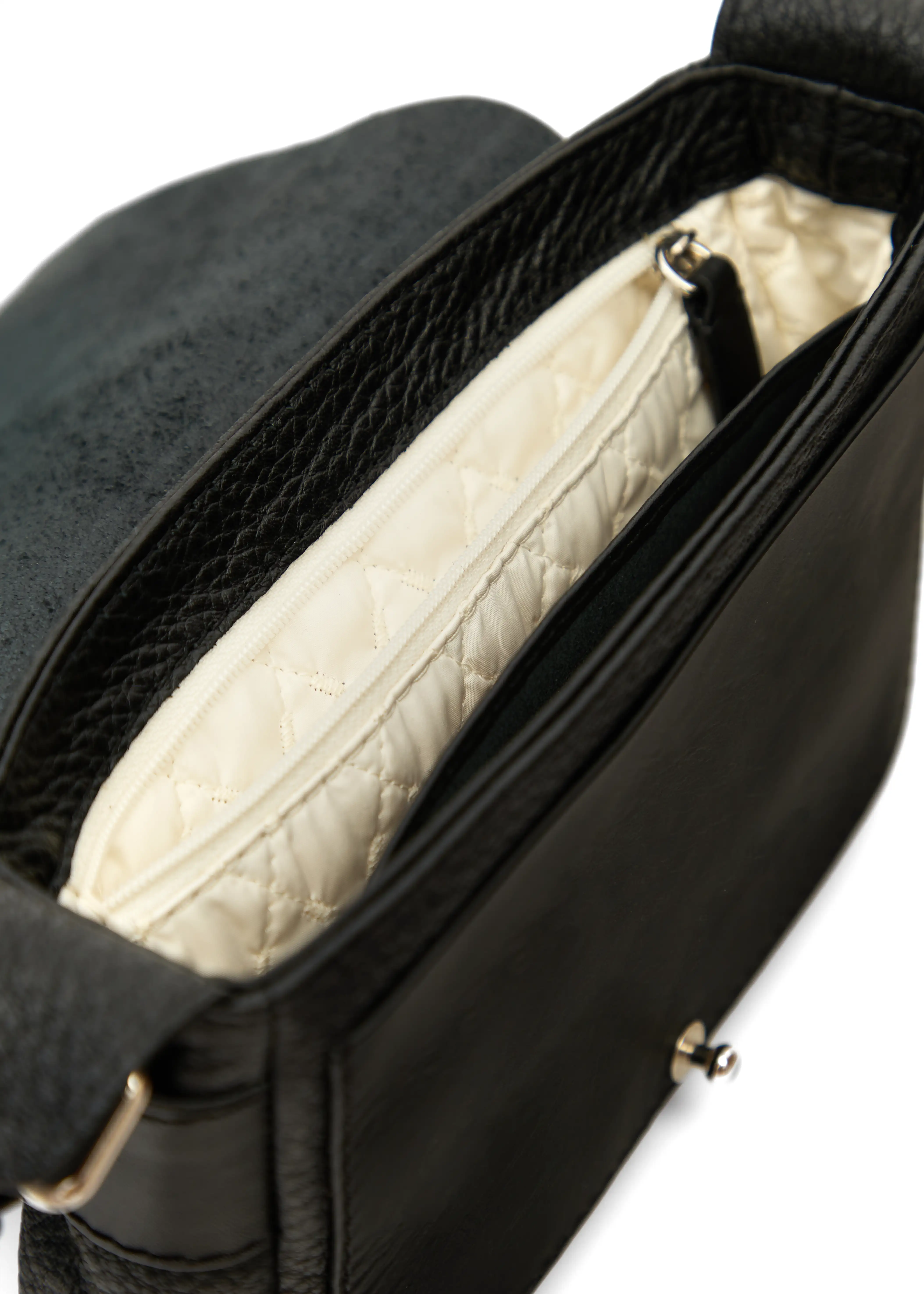 Interior view of the Philini Whitney Black Leather Bag, featuring two compartments: a main section, a zippered pocket in vanilla-colored lining, and a leather phone compartment. A handcrafted designer bag with premium leather and sustainable details.
