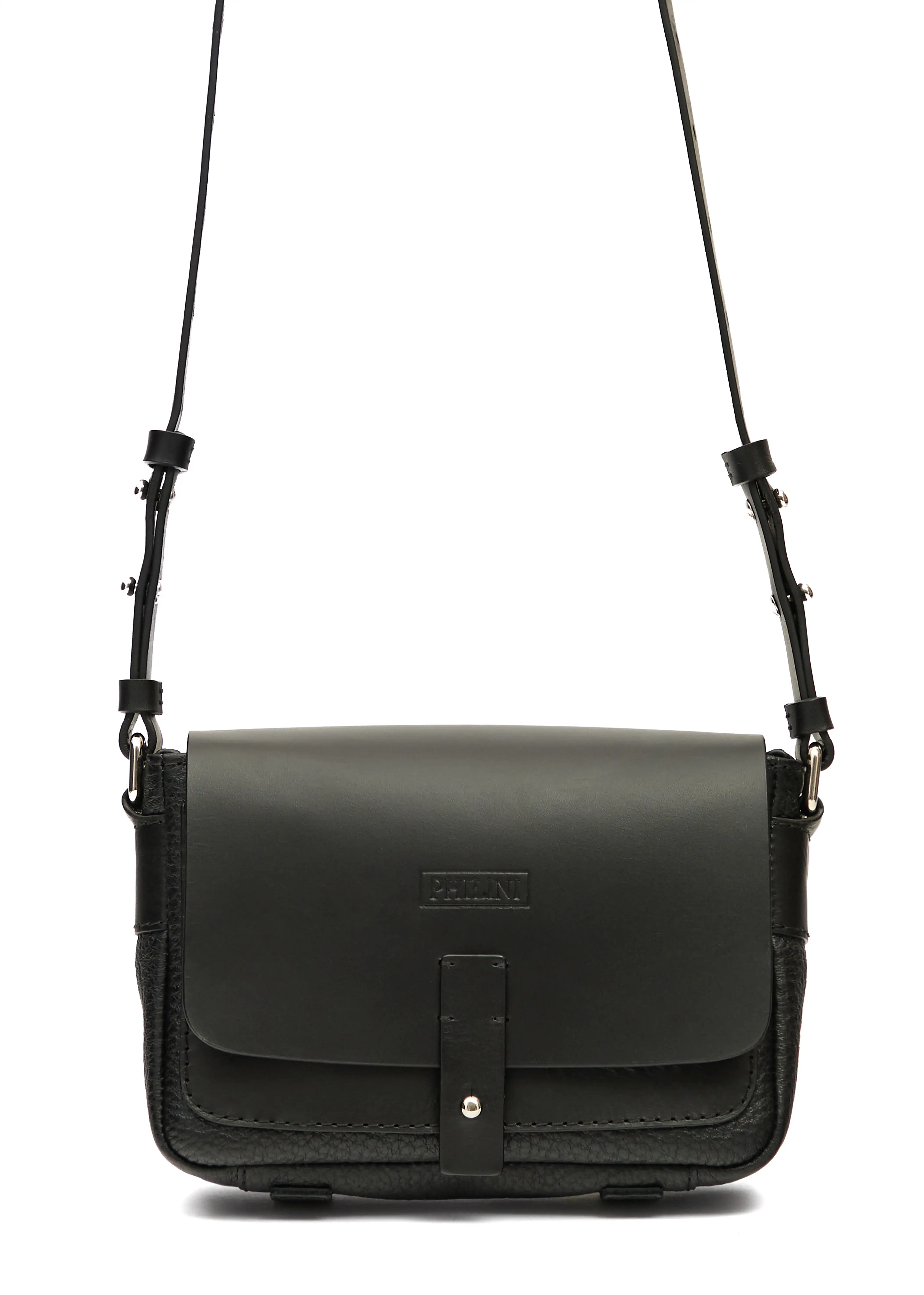 Close-up front view of the Philini Whitney Black Leather Bag, a rectangular handcrafted designer bag with a premium leather flap, silver push-button closure, adjustable strap, and protective leather pads. A sustainable and elegant accessory
