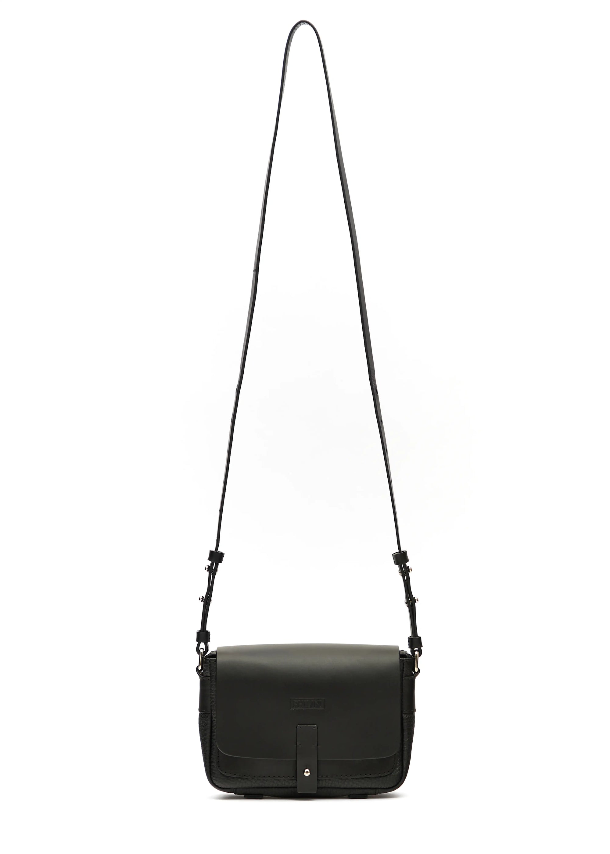 Front view of the Philini Whitney Black Leather Bag, a handcrafted designer bag with a rectangular shape, premium full-grain leather flap, silver push-button closure, and an adjustable strap with silver accents. German-designed and sustainable.