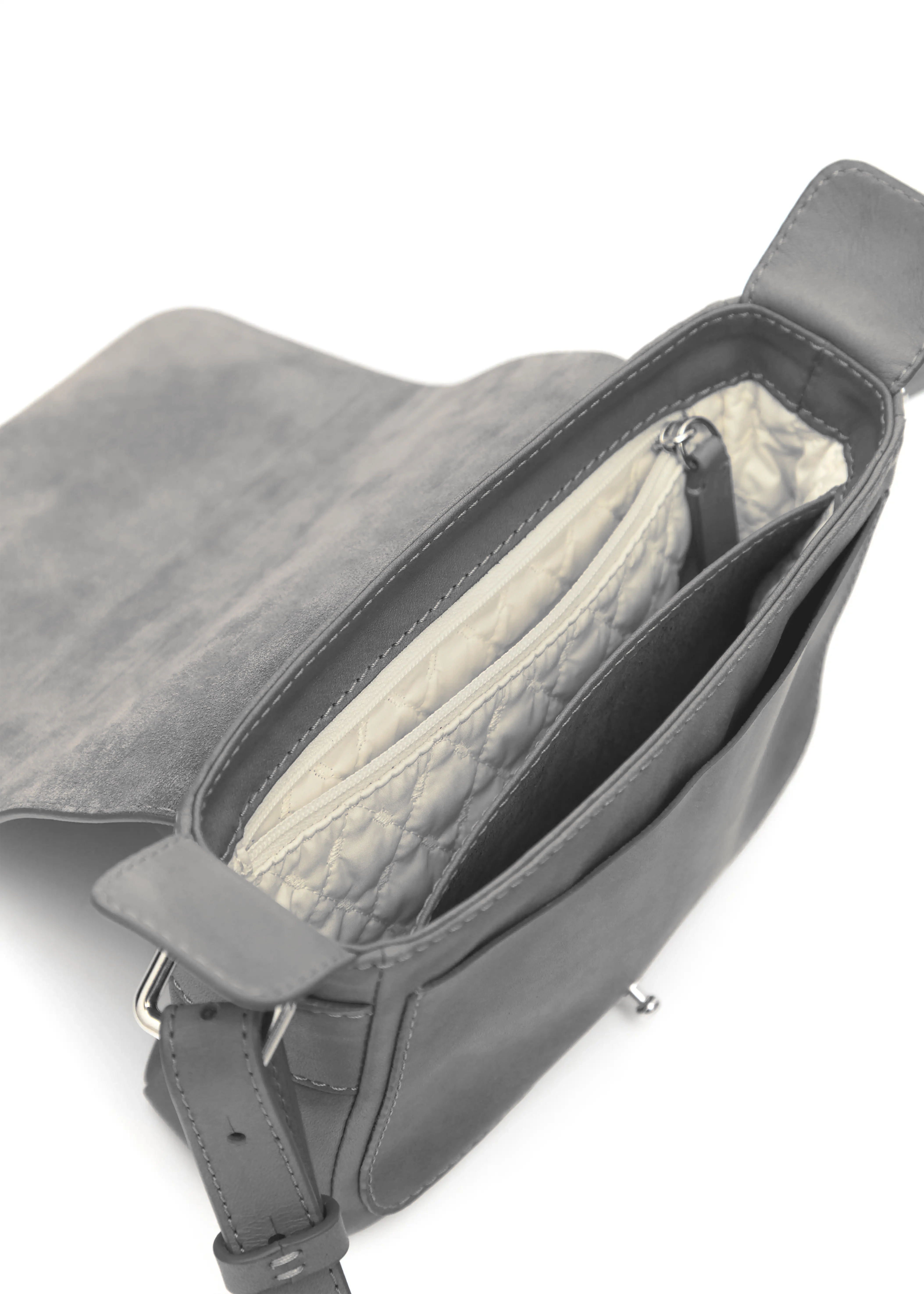 Interior view of the grey Philini Whitney Leather Bag, showing two compartments, zip pocket with vanilla lining, leather phone slot, and shaping plates. A small handcrafted leather bag with eco-conscious details