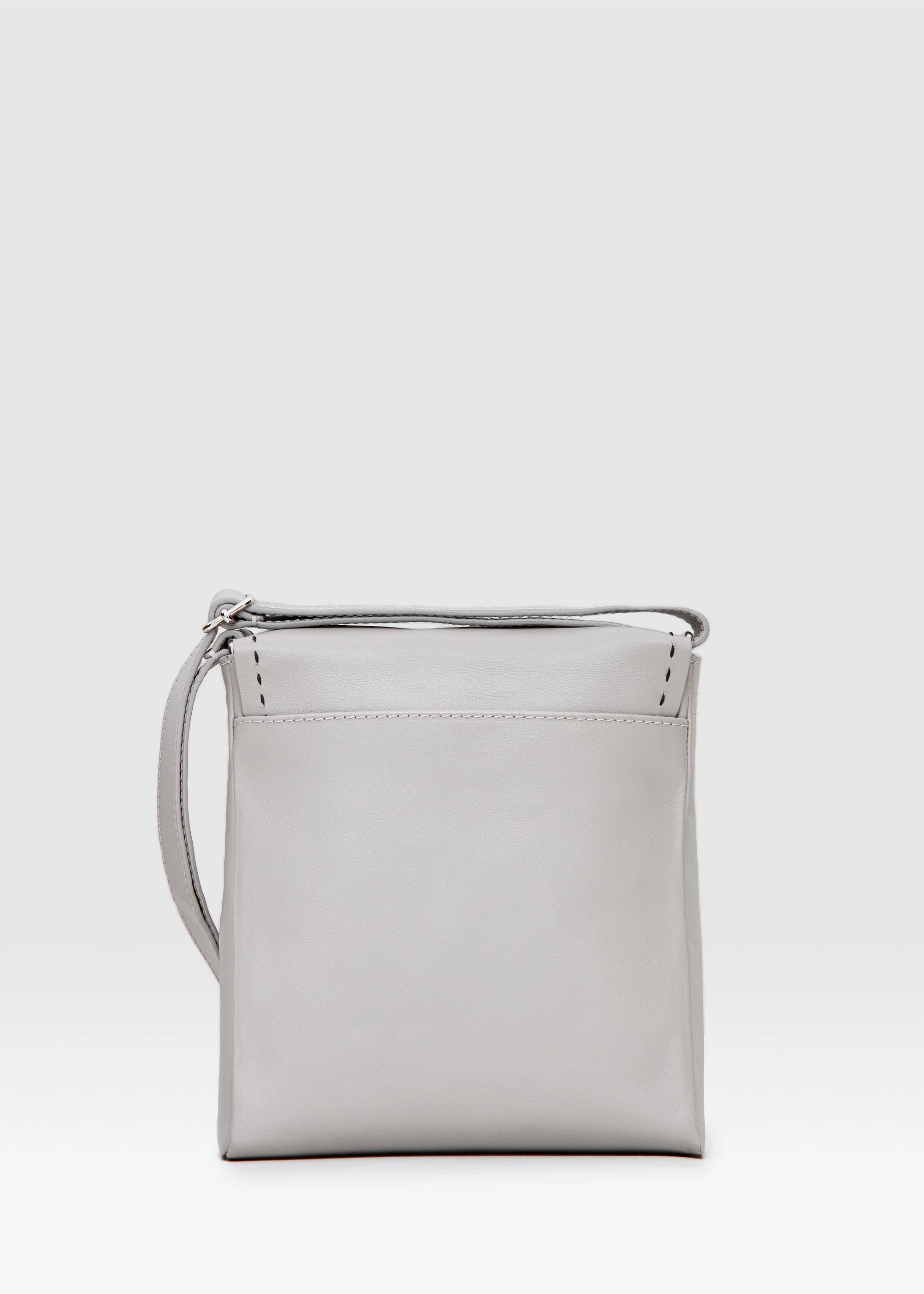 Back view of the Philini Anastasia Messenger Bag in taupe aniline nappa leather, square shape with adjustable leather strap. Premium structured leather handbag, minimalist and elegant for everyday or work use