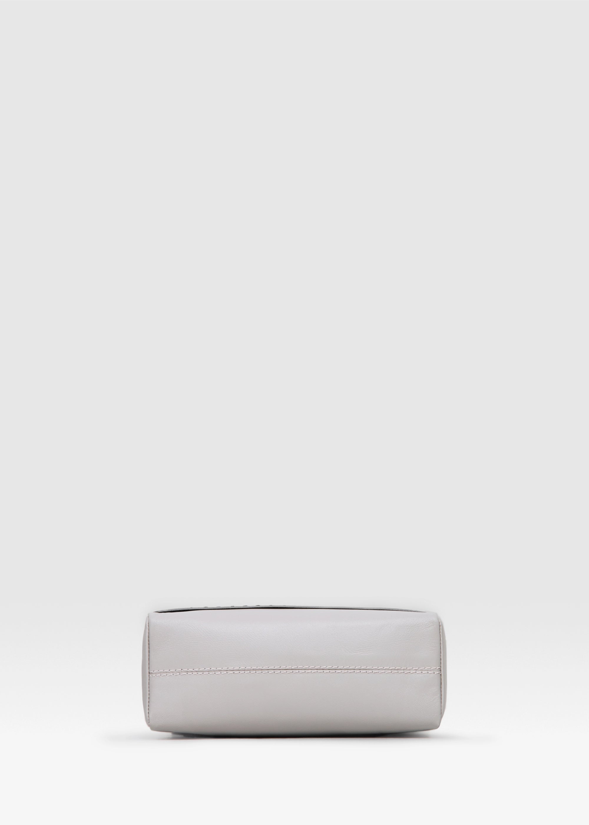 Bottom view of the Philini Anastasia Messenger Bag in taupe aniline nappa leather, square shape with adjustable leather strap. Premium structured leather handbag, minimalist and elegant for everyday or work use