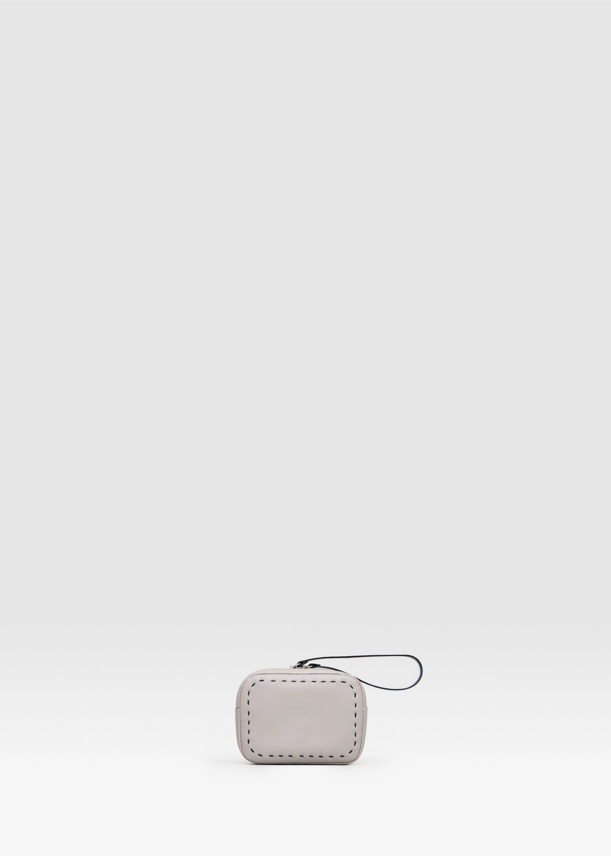 Front view of the Philini Anny Taupe Cosmetic Bag in aniline leather with zip closure and short handlebag