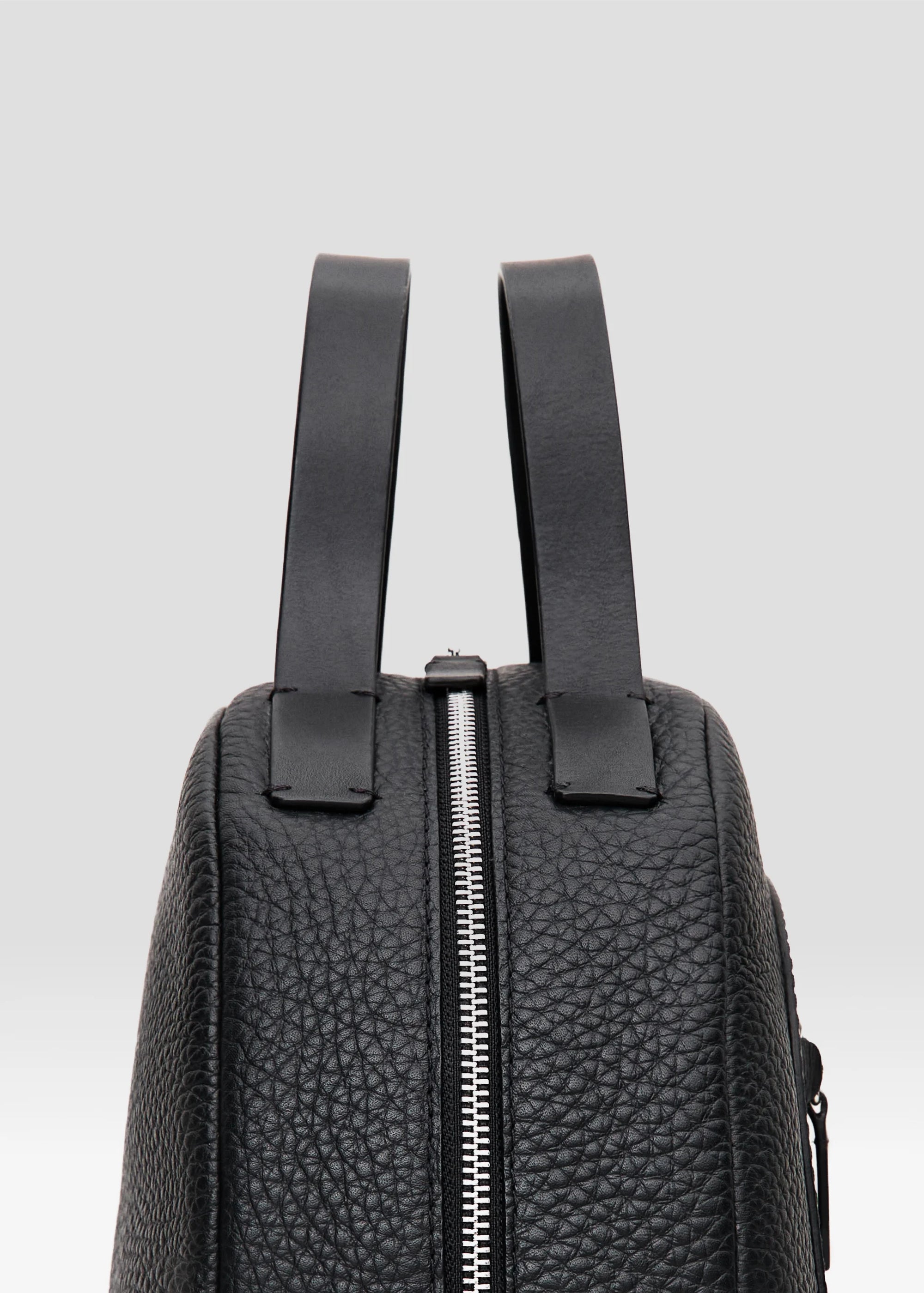 Detailed view of the Philini Domi Black Handbag,  The sustainable, handcrafted luxury leather bag.