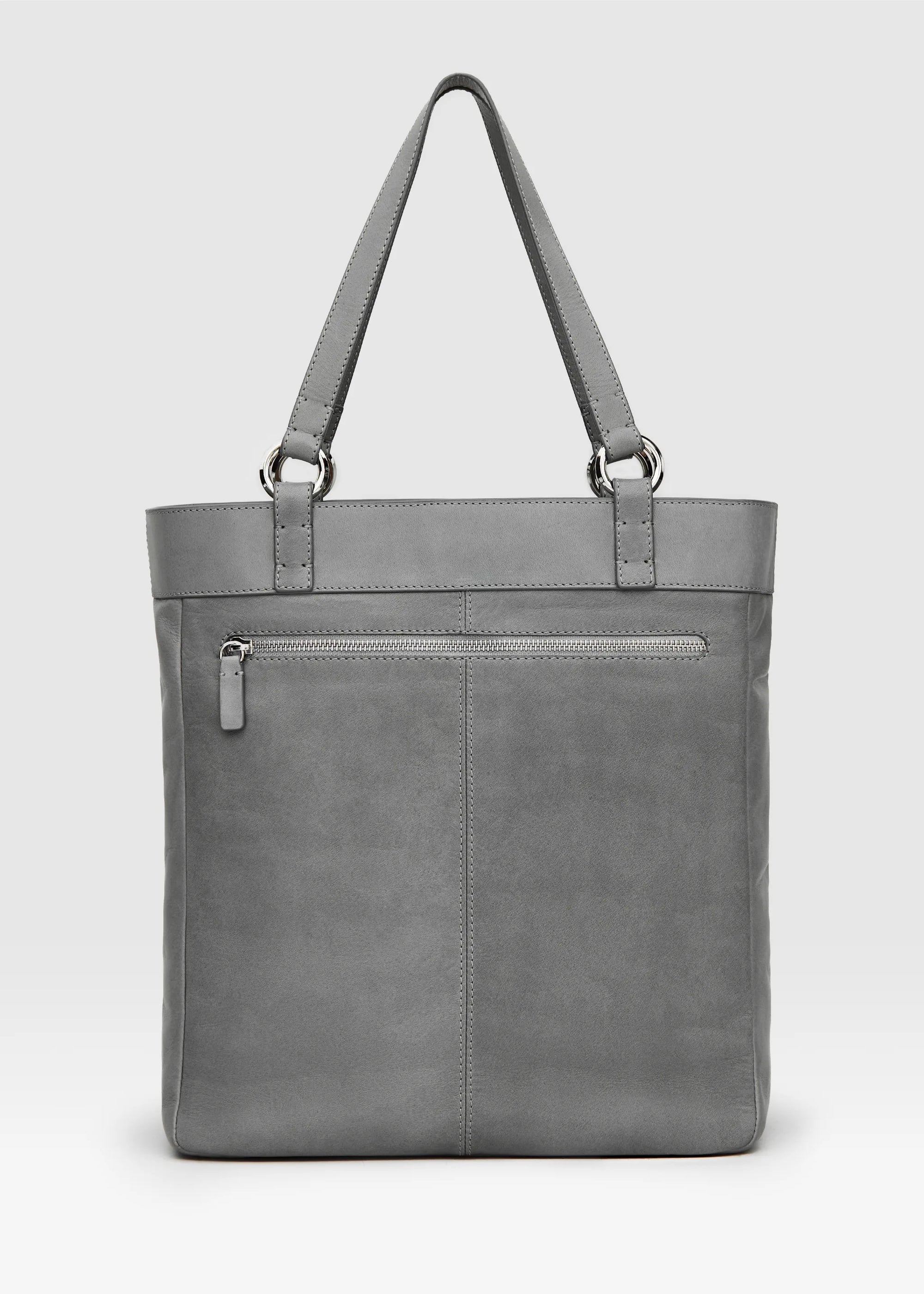 Back view of the Philini Elena Grey Tote Bag in smooth grey aniline leather, featuring a back zipper pocket, handles with silver hoops and hand stitches. The tote is a luxury accessory. 