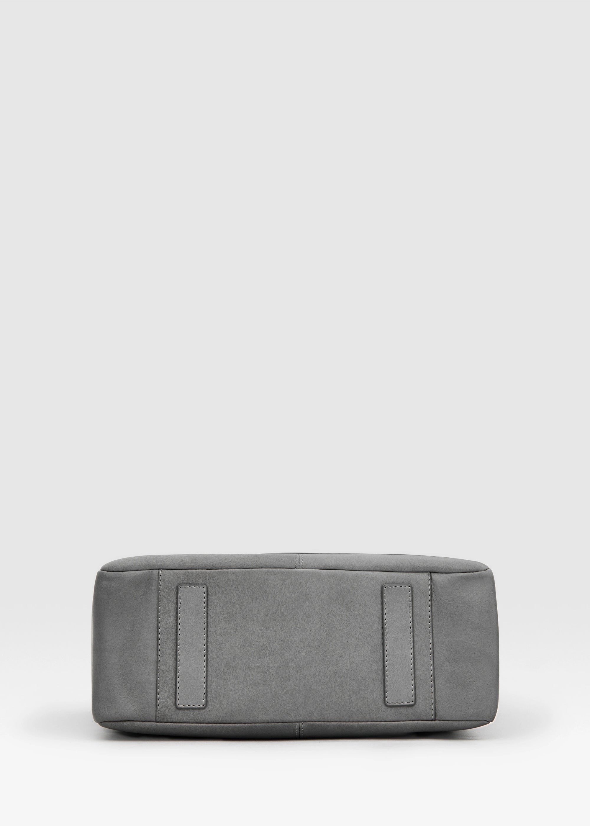 Bottom view of the Philini Elena Grey Tote Bag, showing two protective leather pads as bottom feet, crafted from premium aniline leather for durability and elegance