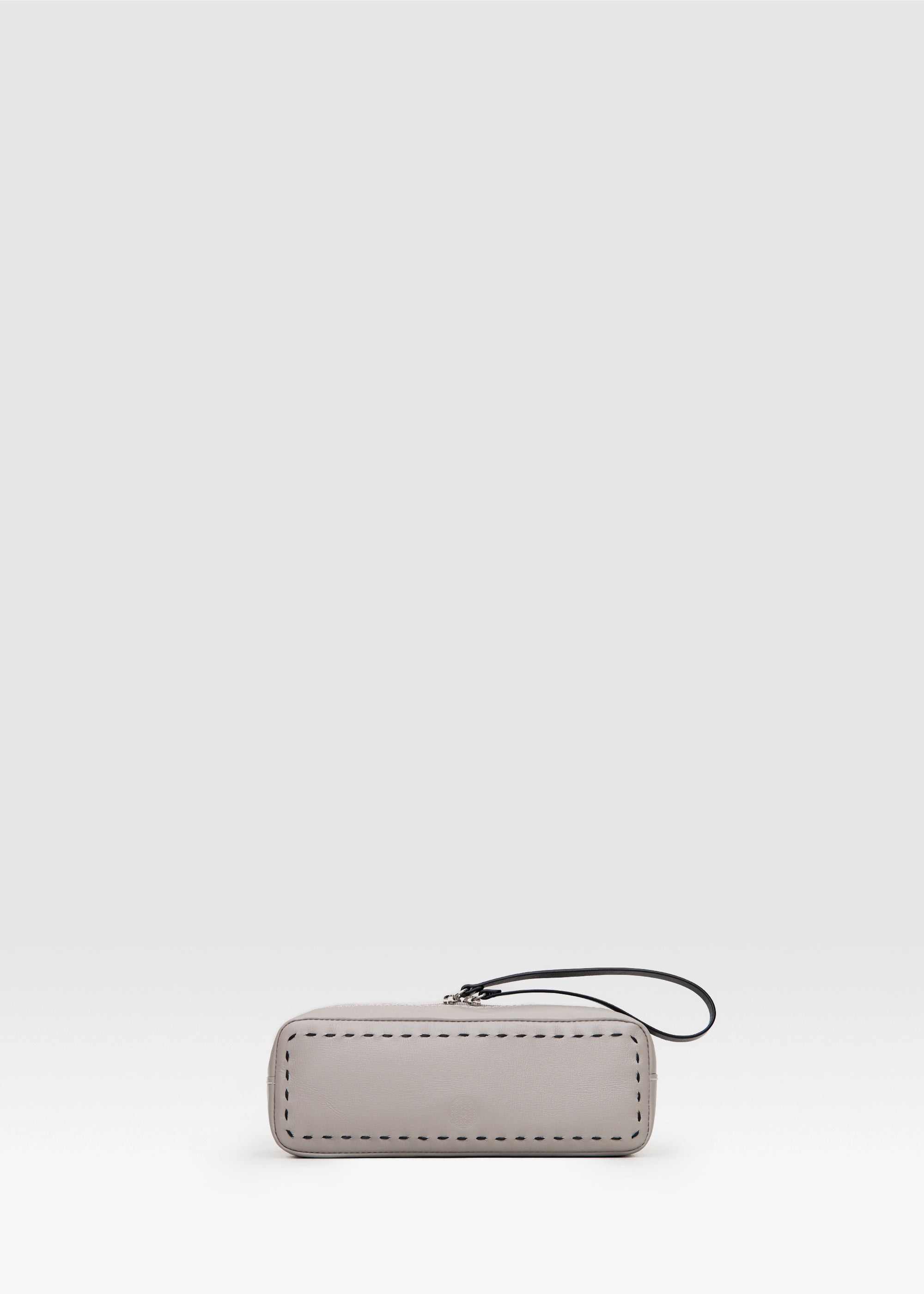 Front view of the Philini Ellie Taupe Cosmetic Bag in aniline leather with zip closure and hand-stitched details