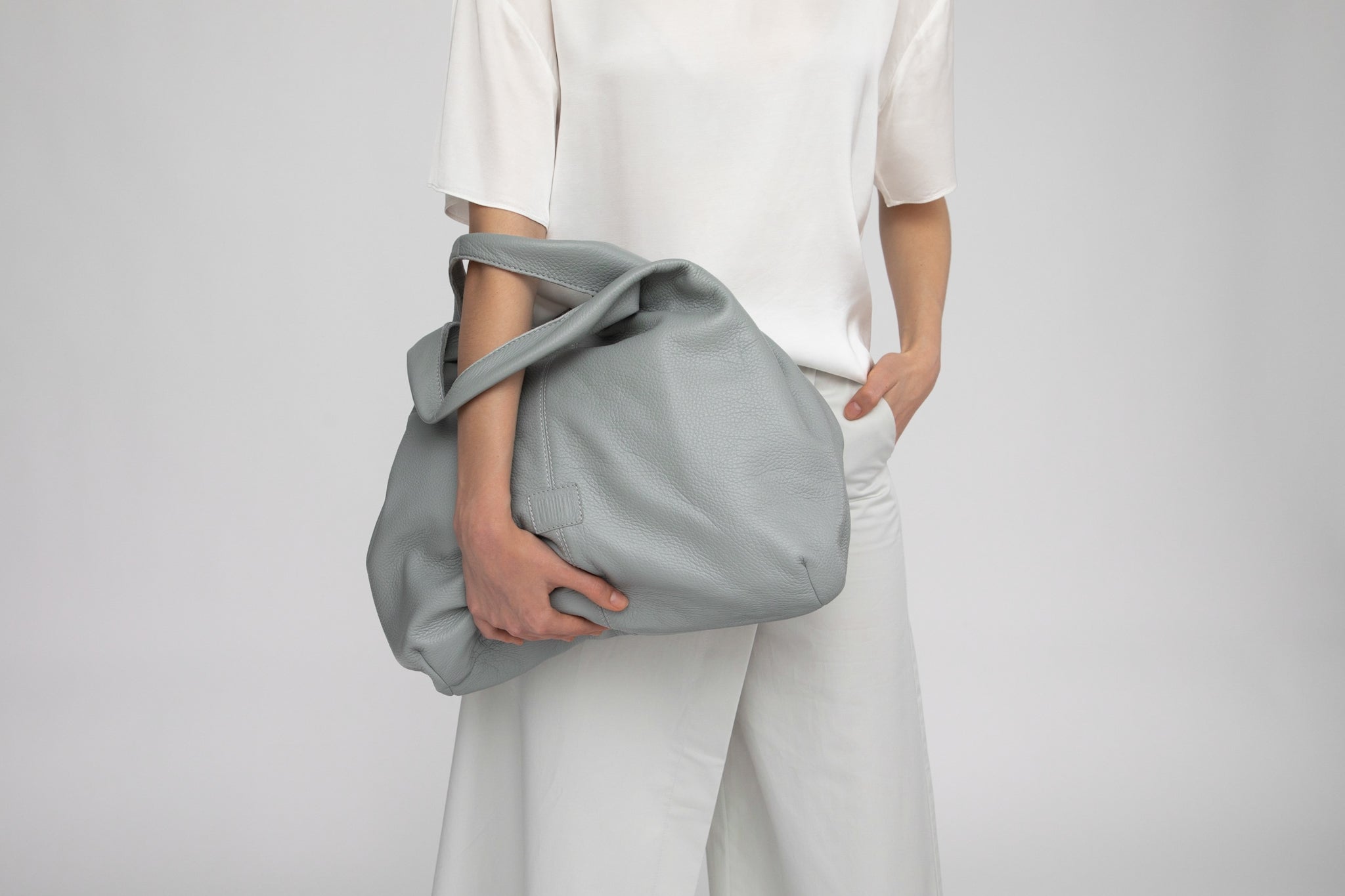 Philini's stylish hobo bag is crafted in grey leather