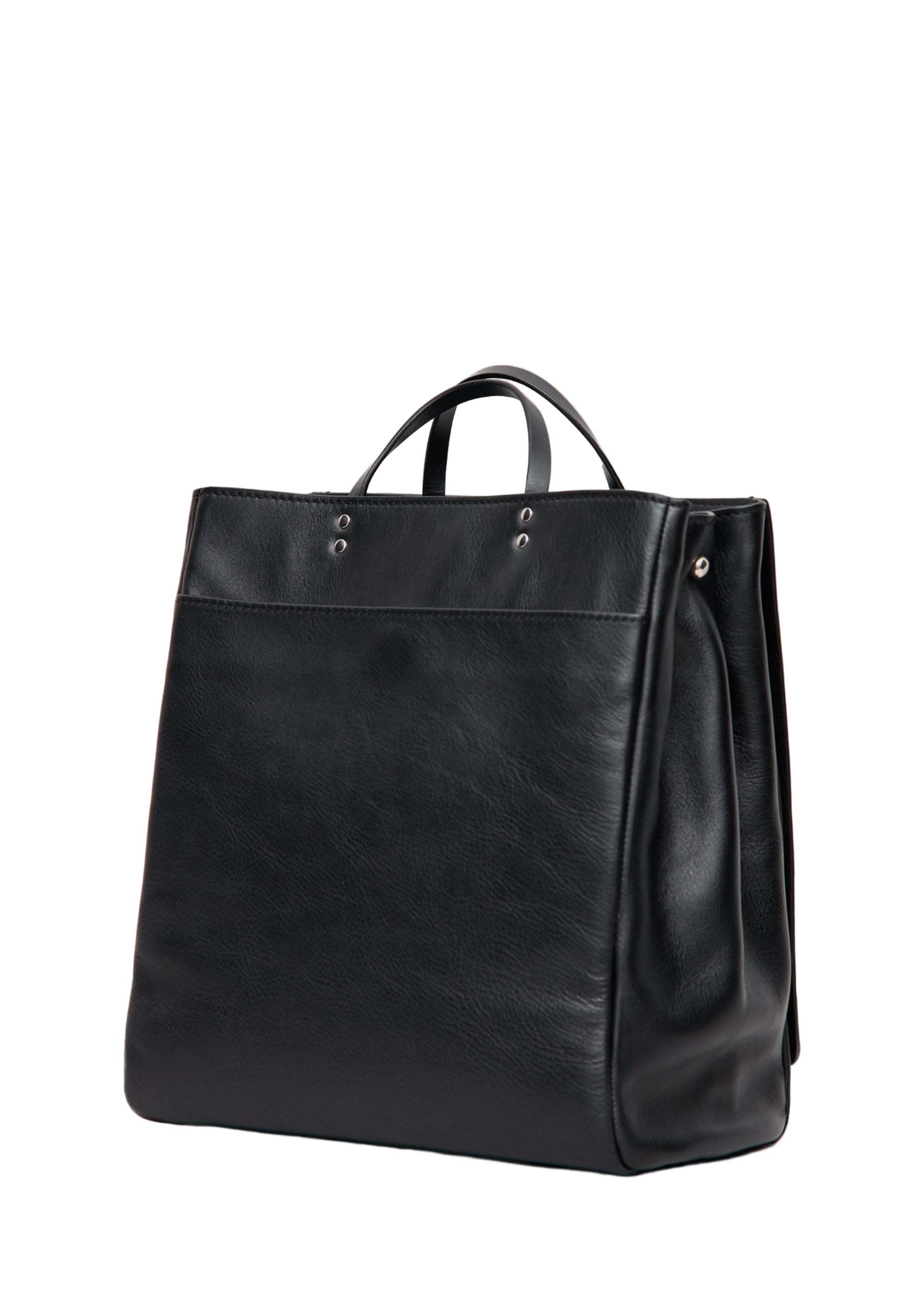 Black leather tote bag on a light gray background