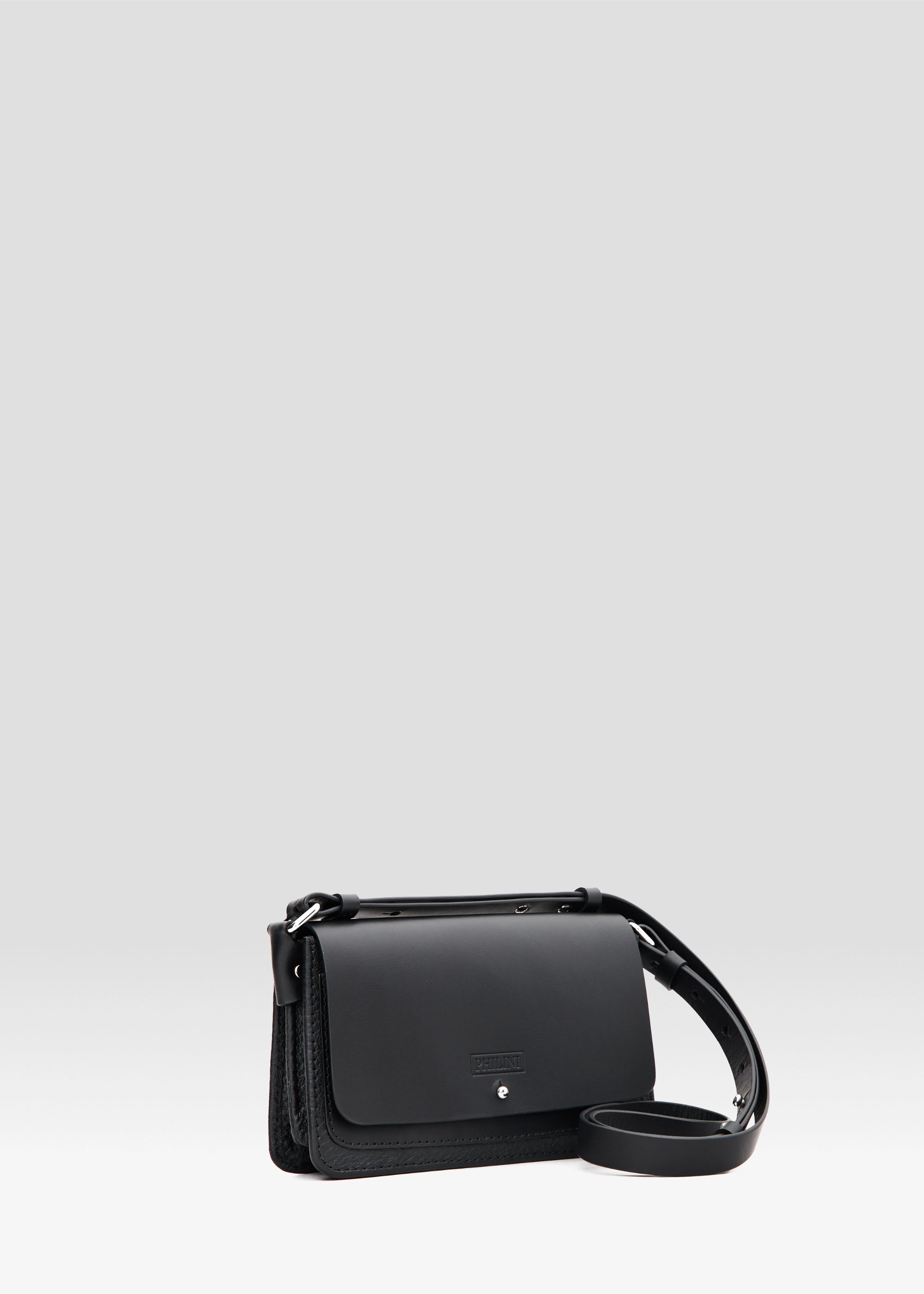 wallet bag featuring a full-grain leather front flap, buffalo leather accordion shape