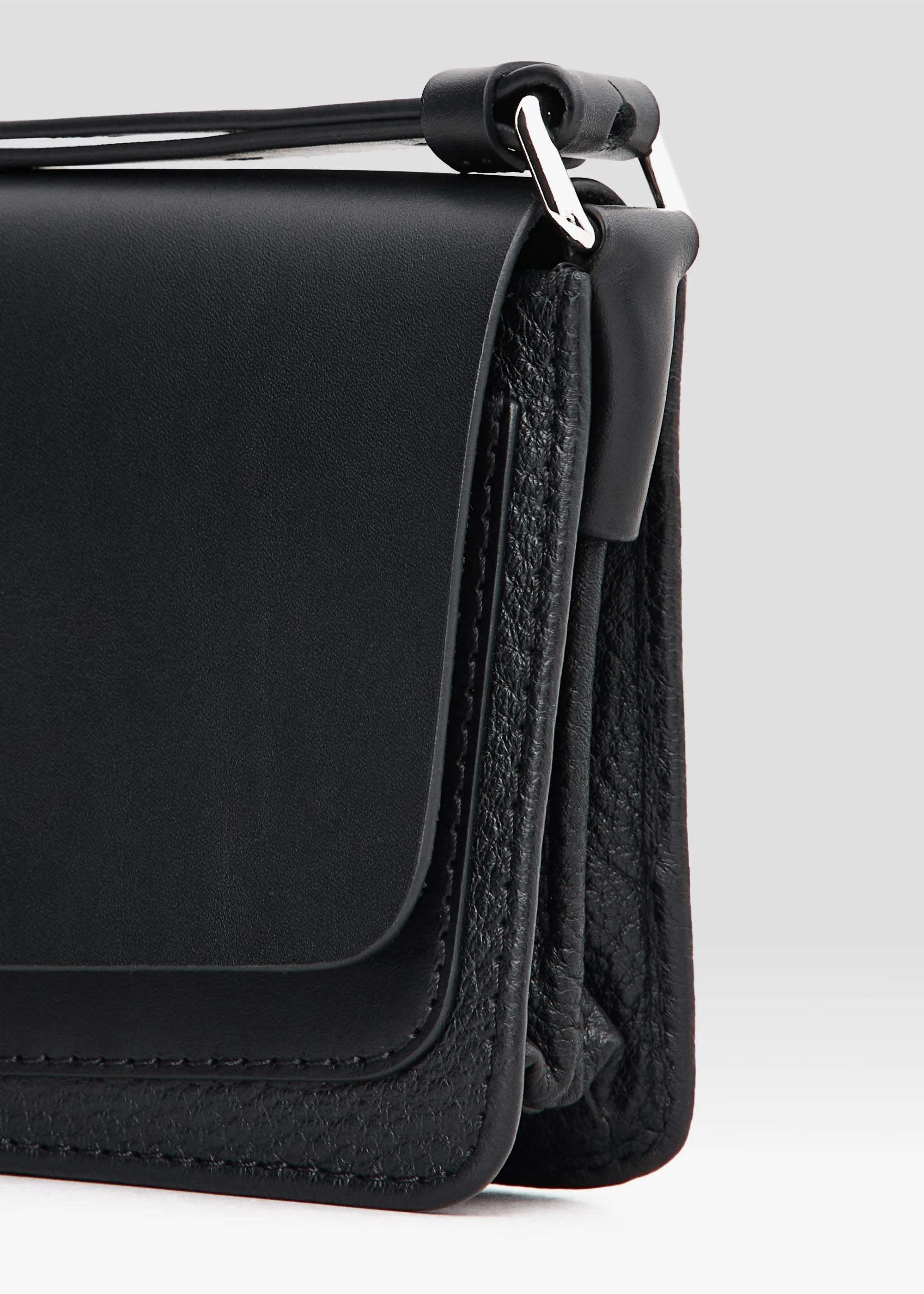 Detailed view of the Philini Mihaela Black Wallet Bag minimalist luxury handbag highlighting handle
