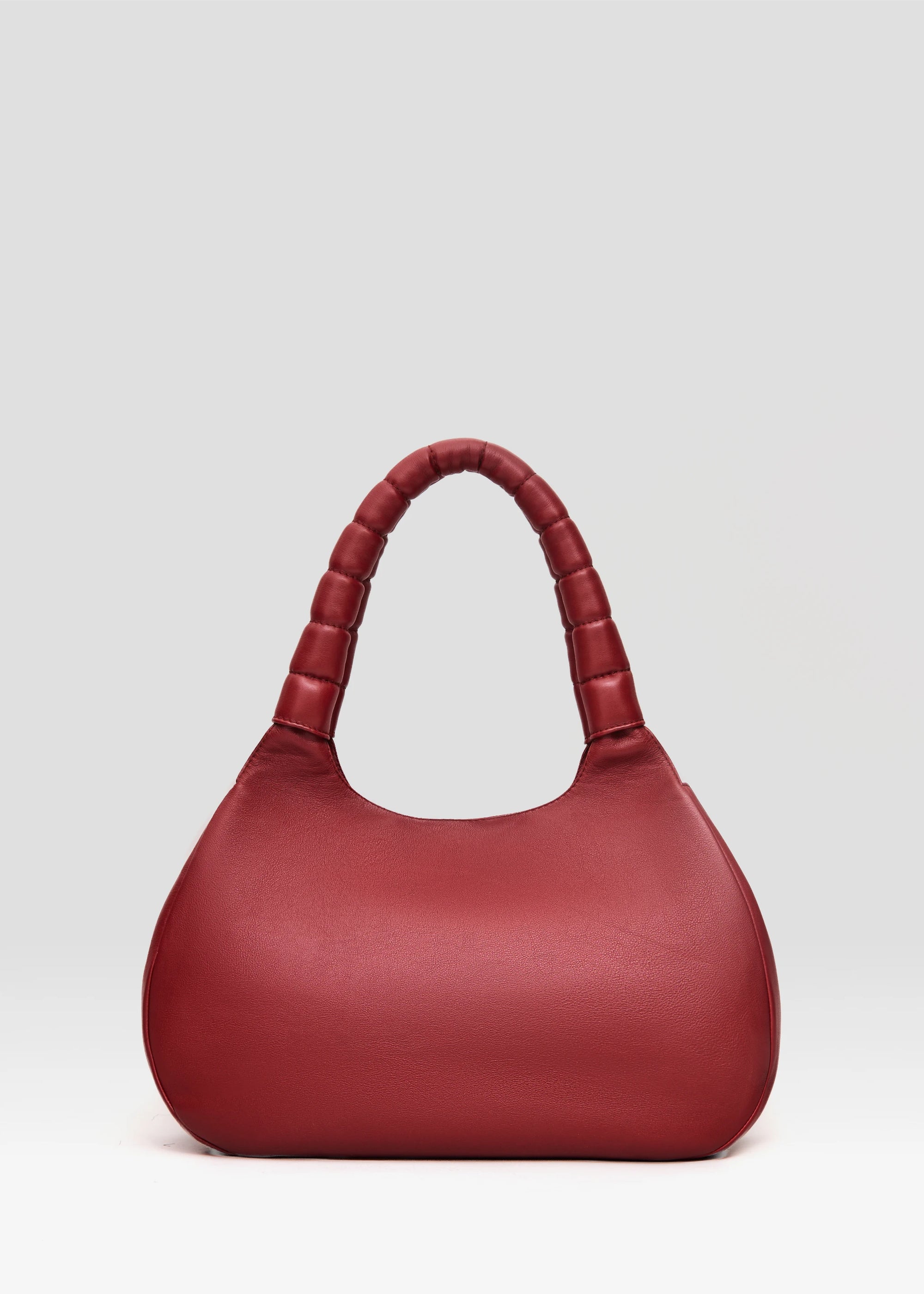 Back view of the Philini Adreann Hobo Bag in red nappa leather, featuring two integrated soft handles and a stamped logo. Individually crafted leather hobo tote 