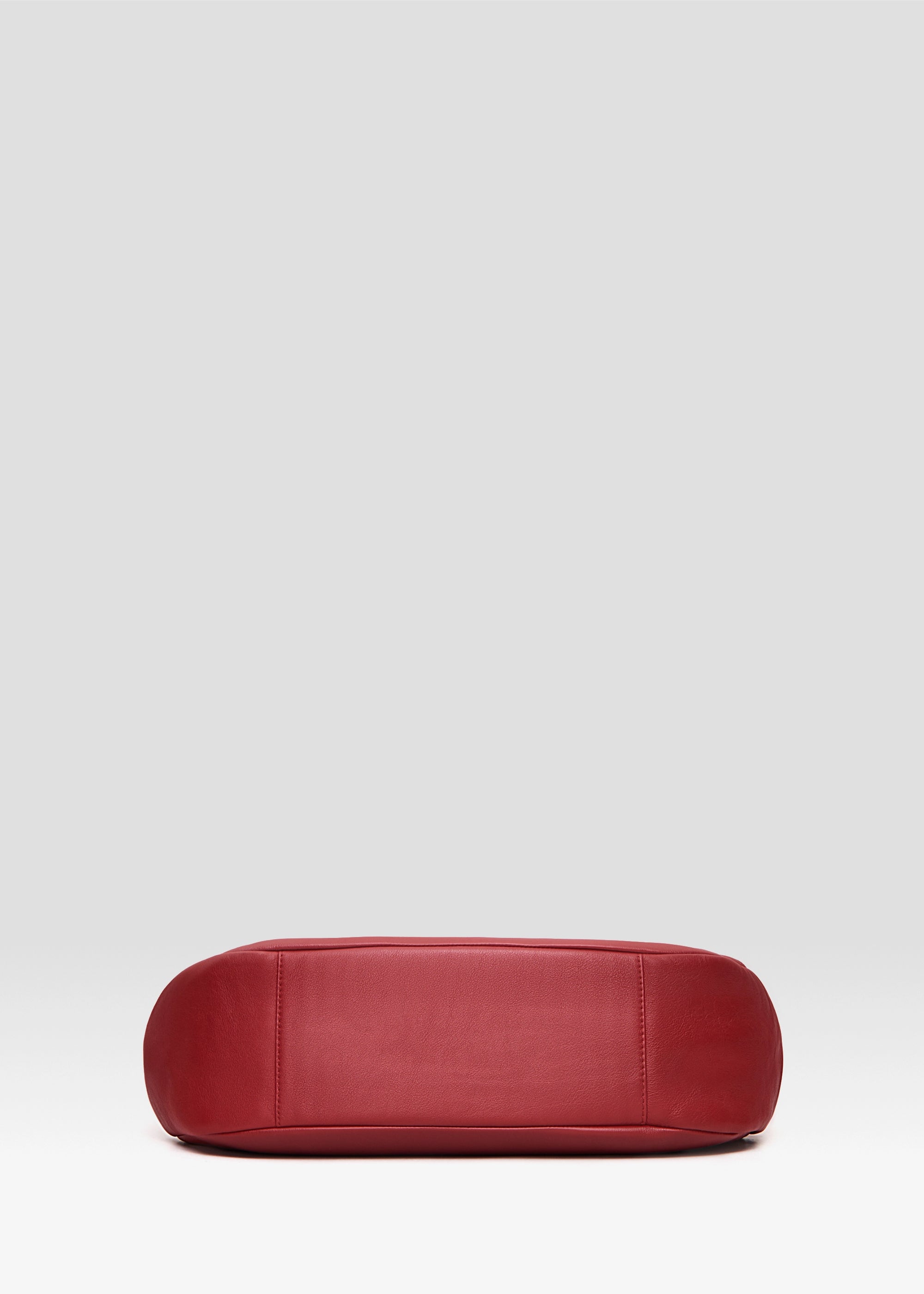 Bottom view of the Philini Adreann Hobo Bag in red nappa leather, highlighting the soft structure and craftsmanship