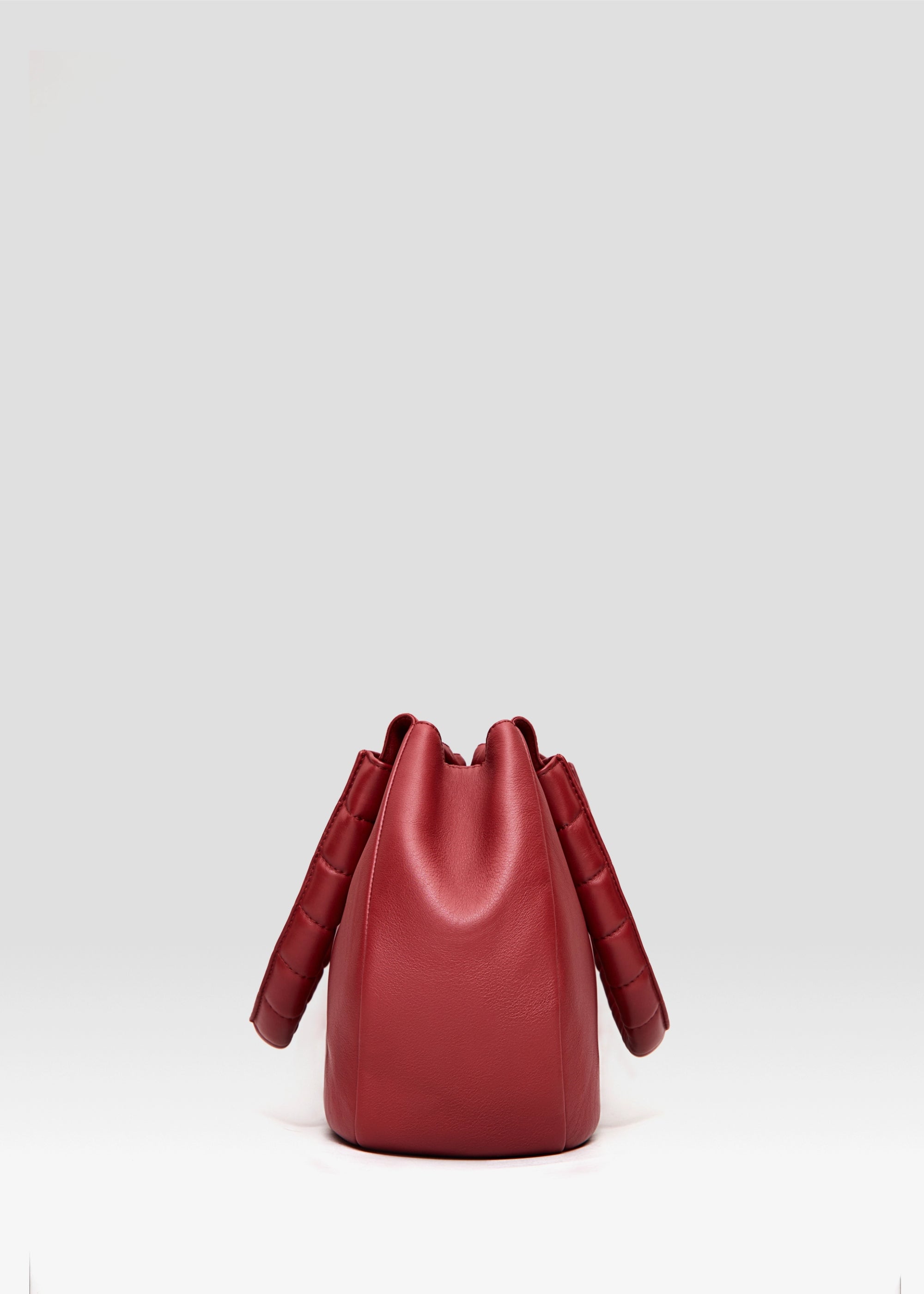 Side view of the Philini Adreann Hobo Bag in red nappa leather, highlighting the soft structure and craftsmanship