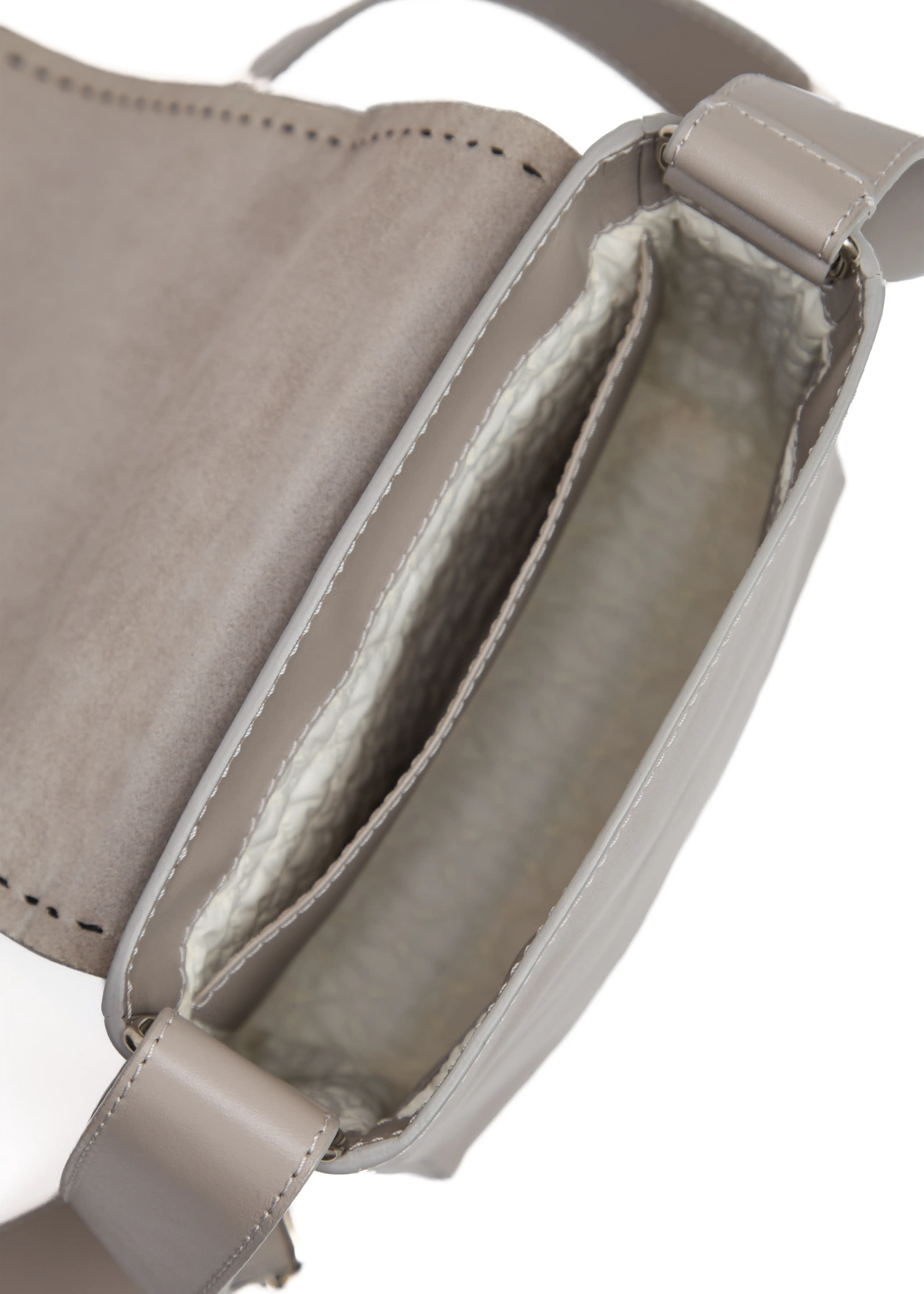 Inside view of the Philini Anastasia Messenger Bag in taupe aniline nappa leather, featuring hand-stitched details, a large open back pocket, and washable vanilla lining. Sustainable luxury leather handbag designed for everyday use