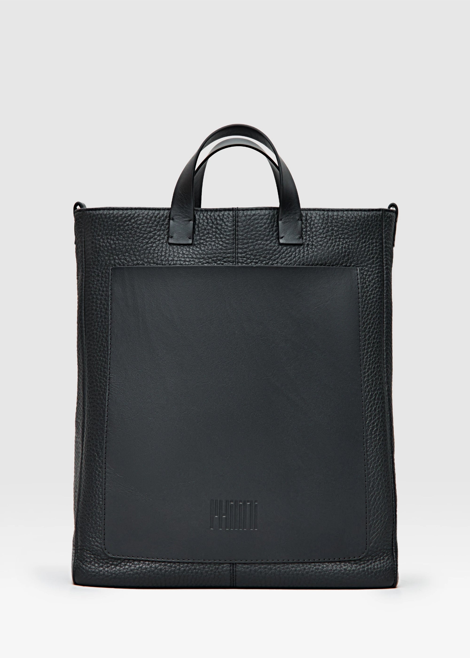 Philini handcrafted black leather tote bag Andrea with a minimalist design, featuring a sleek rectangular shape, durable top handles, and an adjustable shoulder strap. Made from premium full-grain European leather, this timeless and sustainable bag is perfect for modern women seeking elegance and functionality. Ethically crafted in small batches, ideal for work or casual use