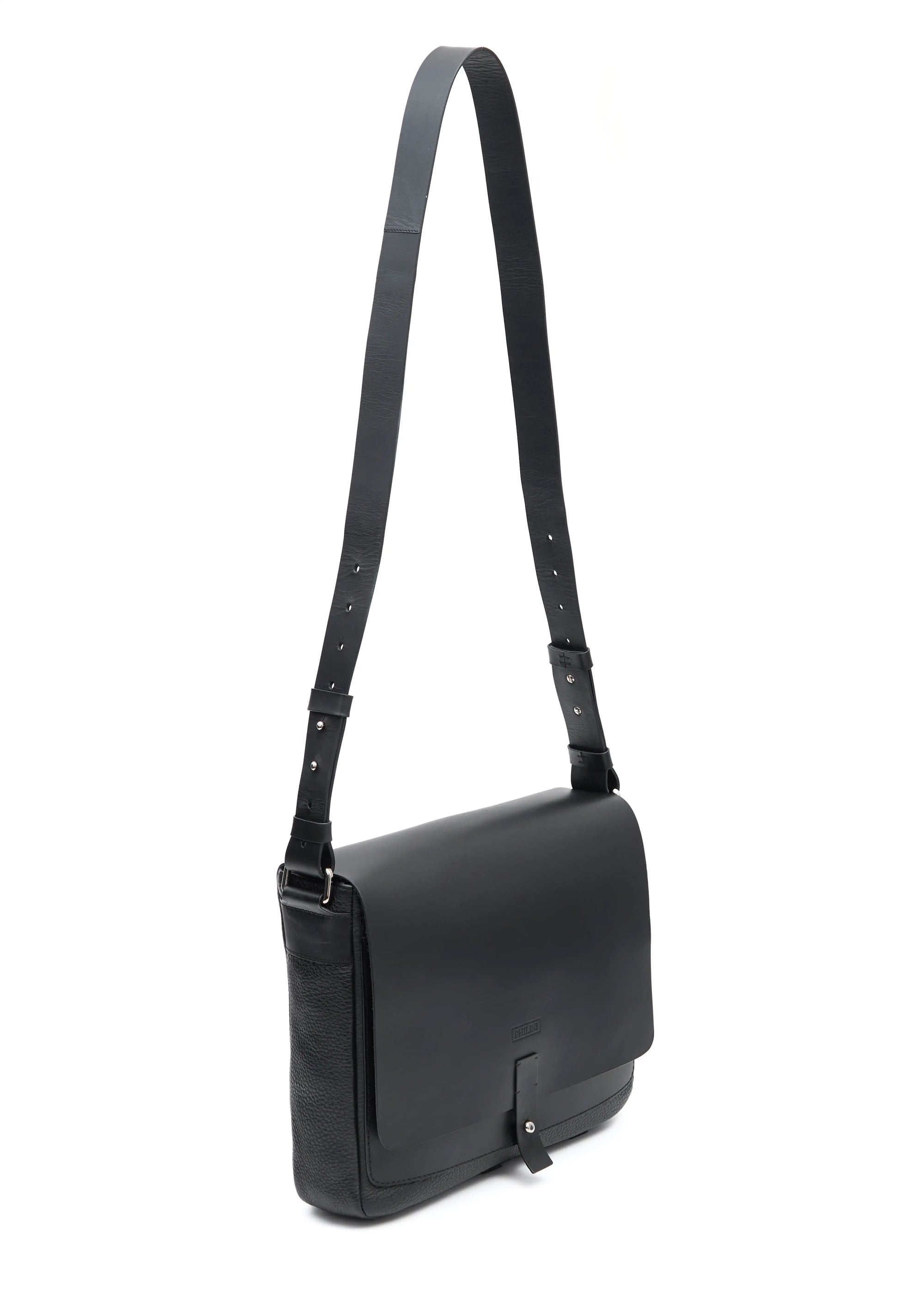 Angled view of a handcrafted luxury leather handbag Aneta in black made from full-grain premium leather sourced from Europe. This elegant and durable design combines timeless aesthetics with sustainable craftsmanship, ideal for women seeking exclusive and versatile fashion accessories.