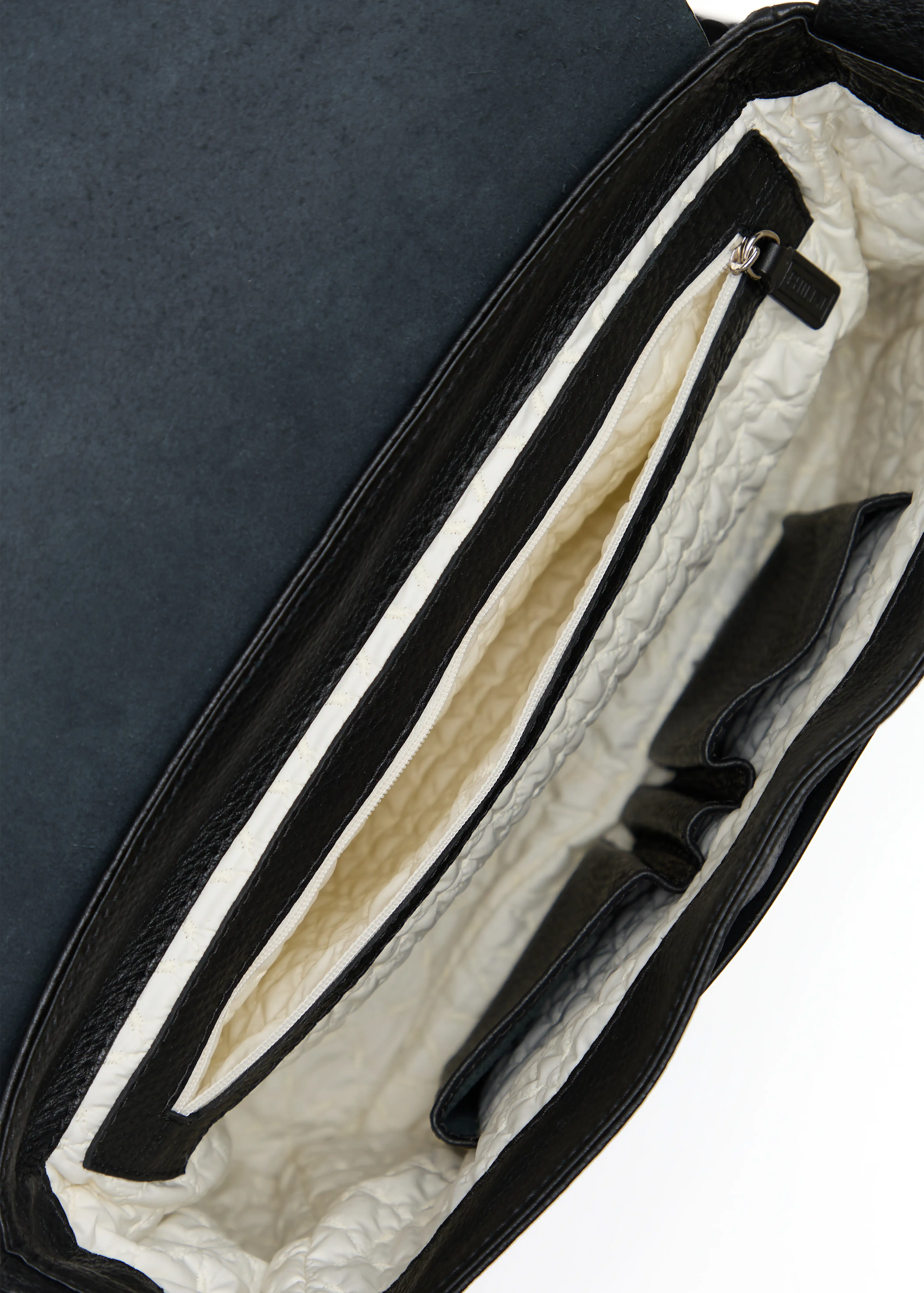 Interior view of the Philini Aneta Bag in Black, showcasing multiple pockets, washable lining, and functional design details.