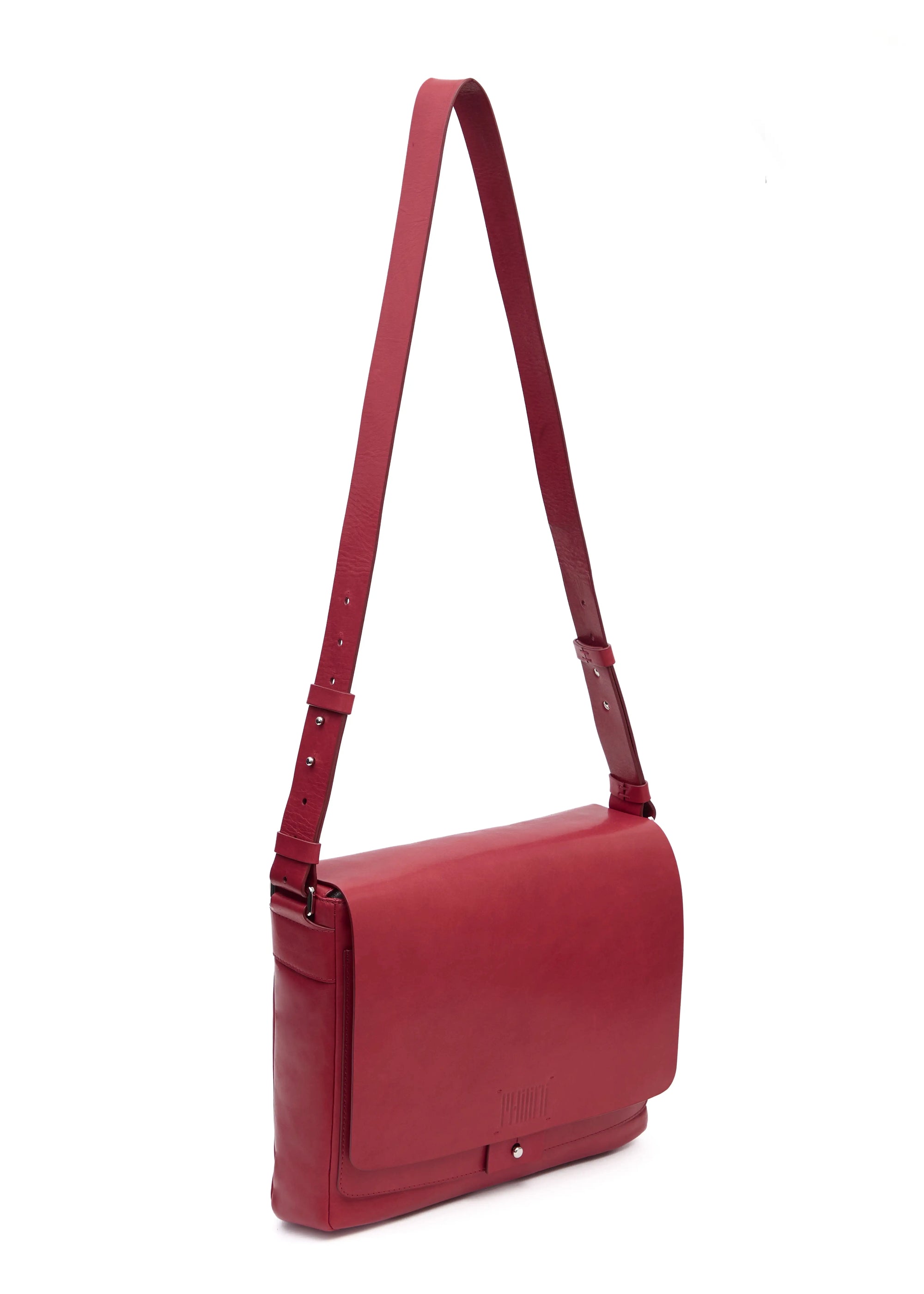 Angled view of the Philini Aneta Bag in Red, featuring a large rectangular shape, an adjustable leather strap, and silver-colored accents crafted from natural red aniline leather