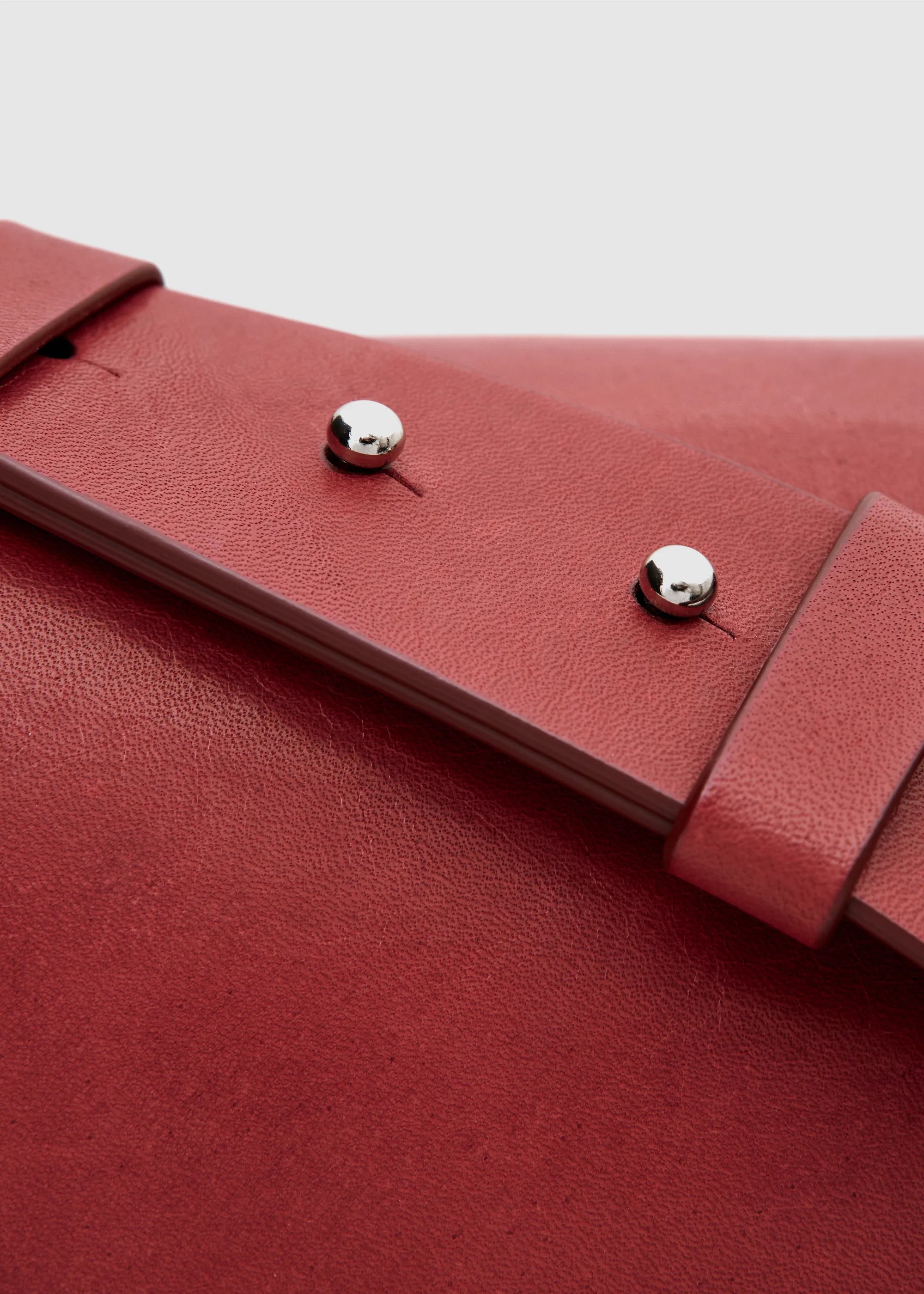 Philini Aneta Bag in red, close up view showing handcrafted full-grain and buffalo leather, elegant and durable handbag design.