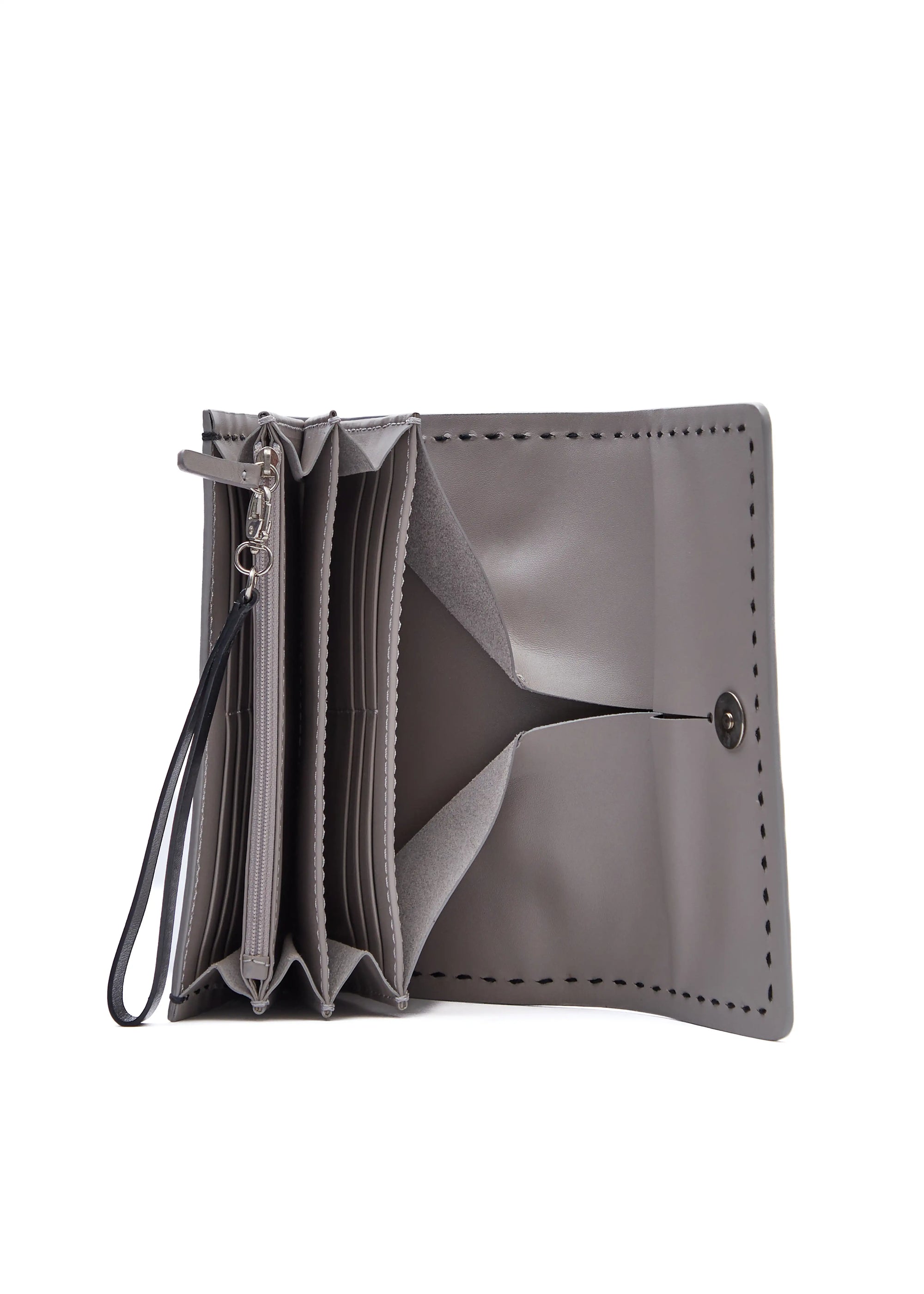 Inside view of the Philini Birgit Wallet in taupe nappa leather, rectangular shape with open flap, magnetic closure, card and zip coin pockets, cash compartments, and short flat handle. Handmade luxury leather wallet