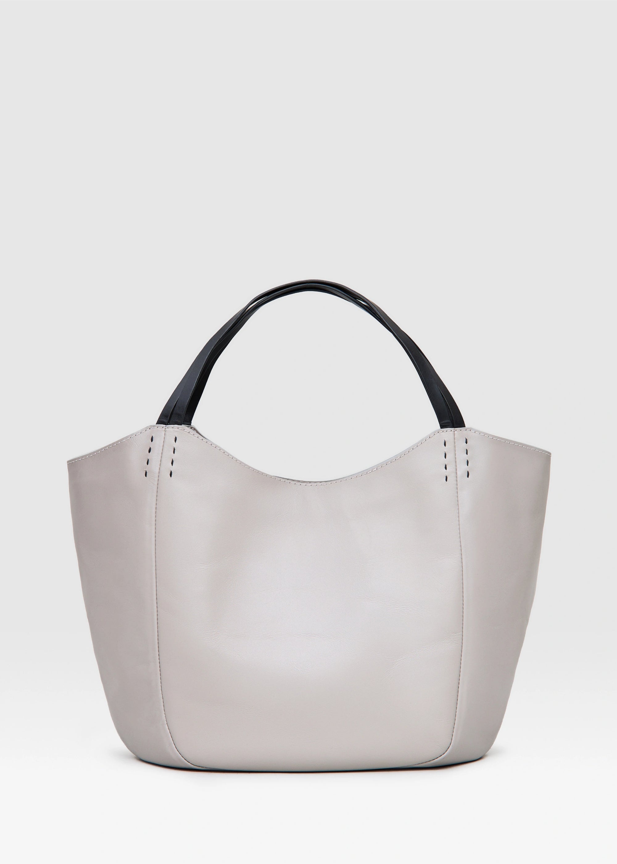Back view of the Philini Charlotte Tote Bag in taupe aniline calf leather, with double flat handles, magnetic button closure, and subtle black hand-stitching. Premium handcrafted leather tote for women, ideal as a chic everyday handbag