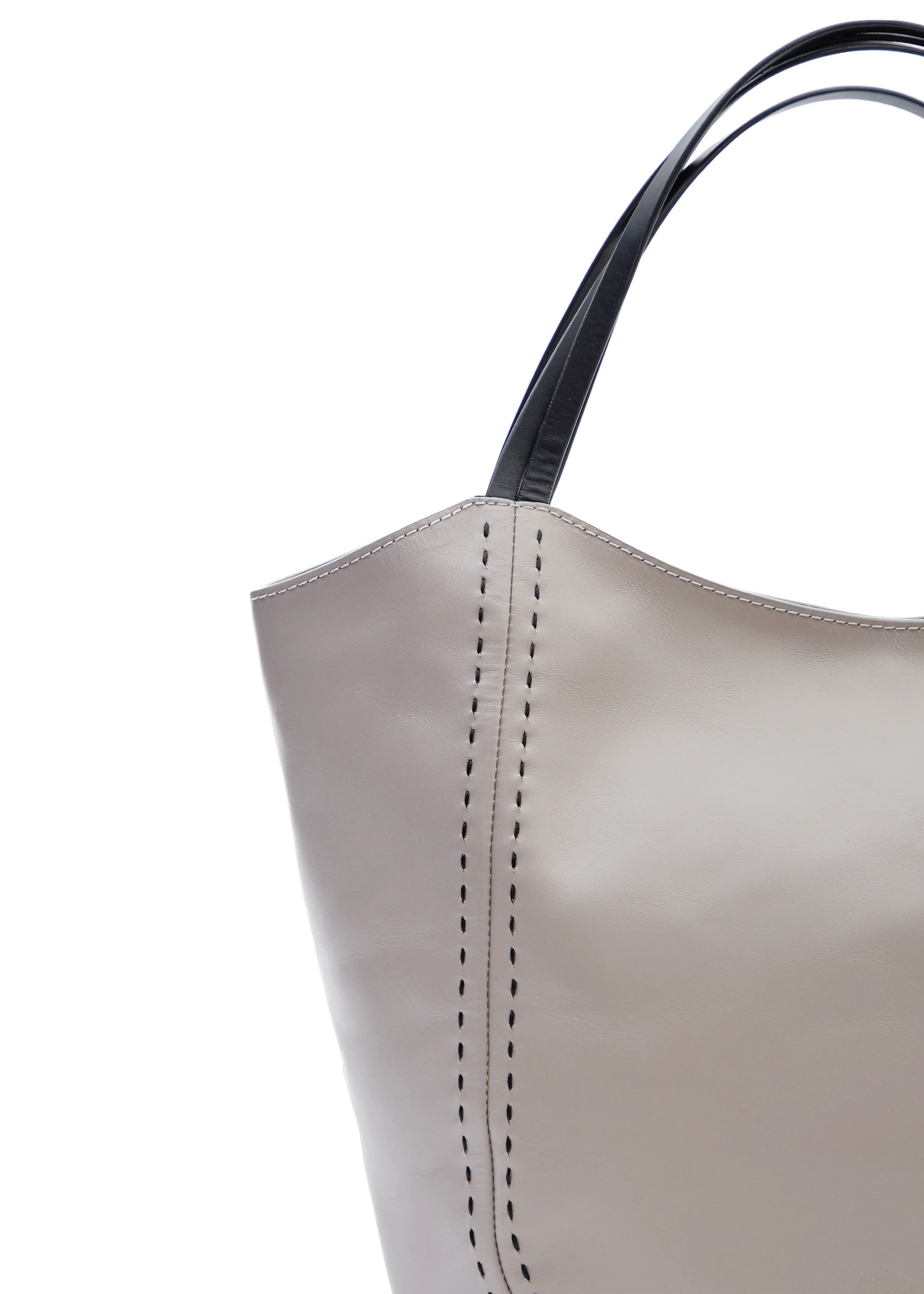 Close front view of the Philini Charlotte Tote Bag in taupe aniline calf leather, showing double flat handles and black hand-stitching. Luxury leather tote, elegant and spacious for everyday use.