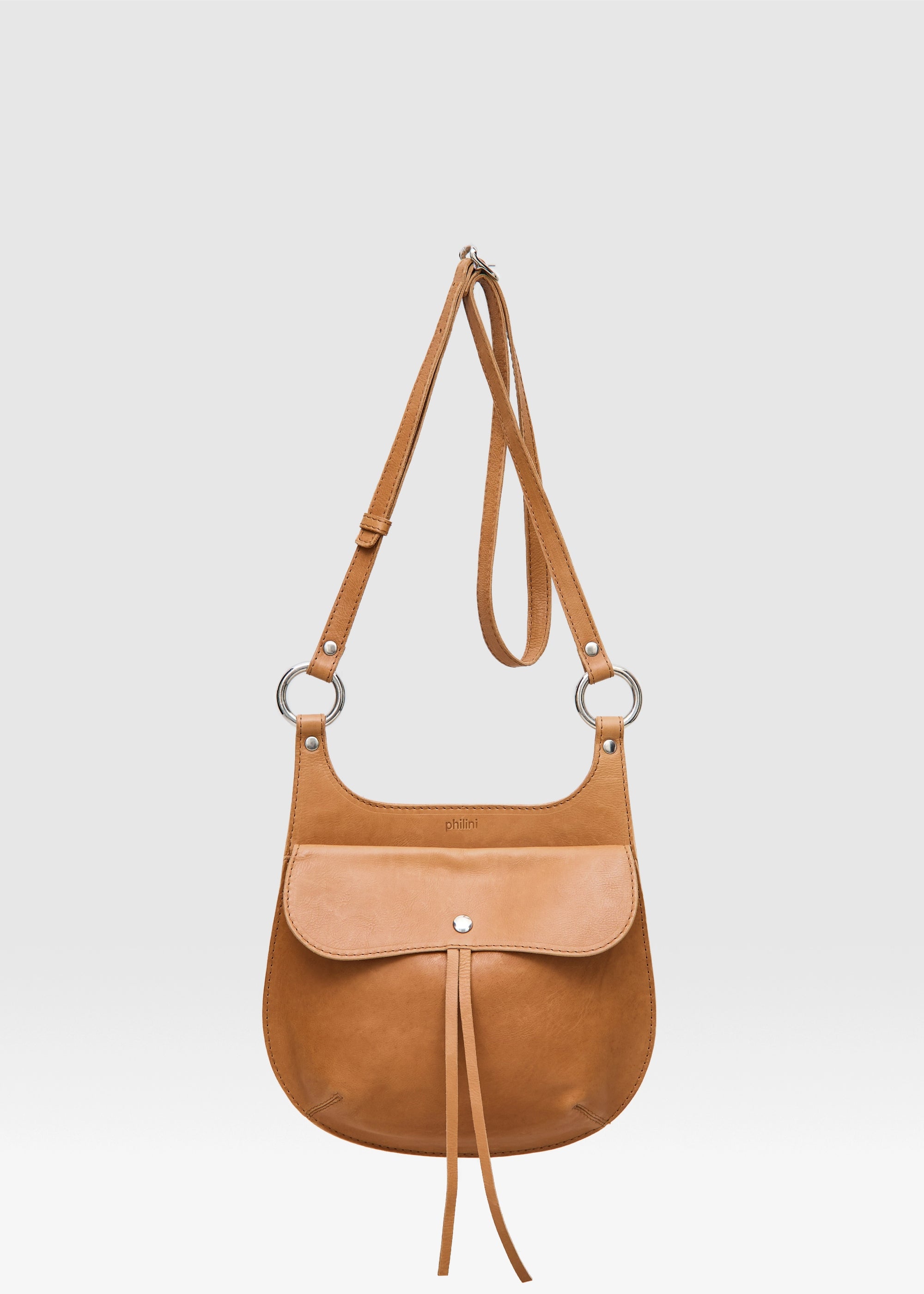 Front view of the Philini Cowboy Crossbody Bag in cognac calf leather, rounded saddle silhouette 