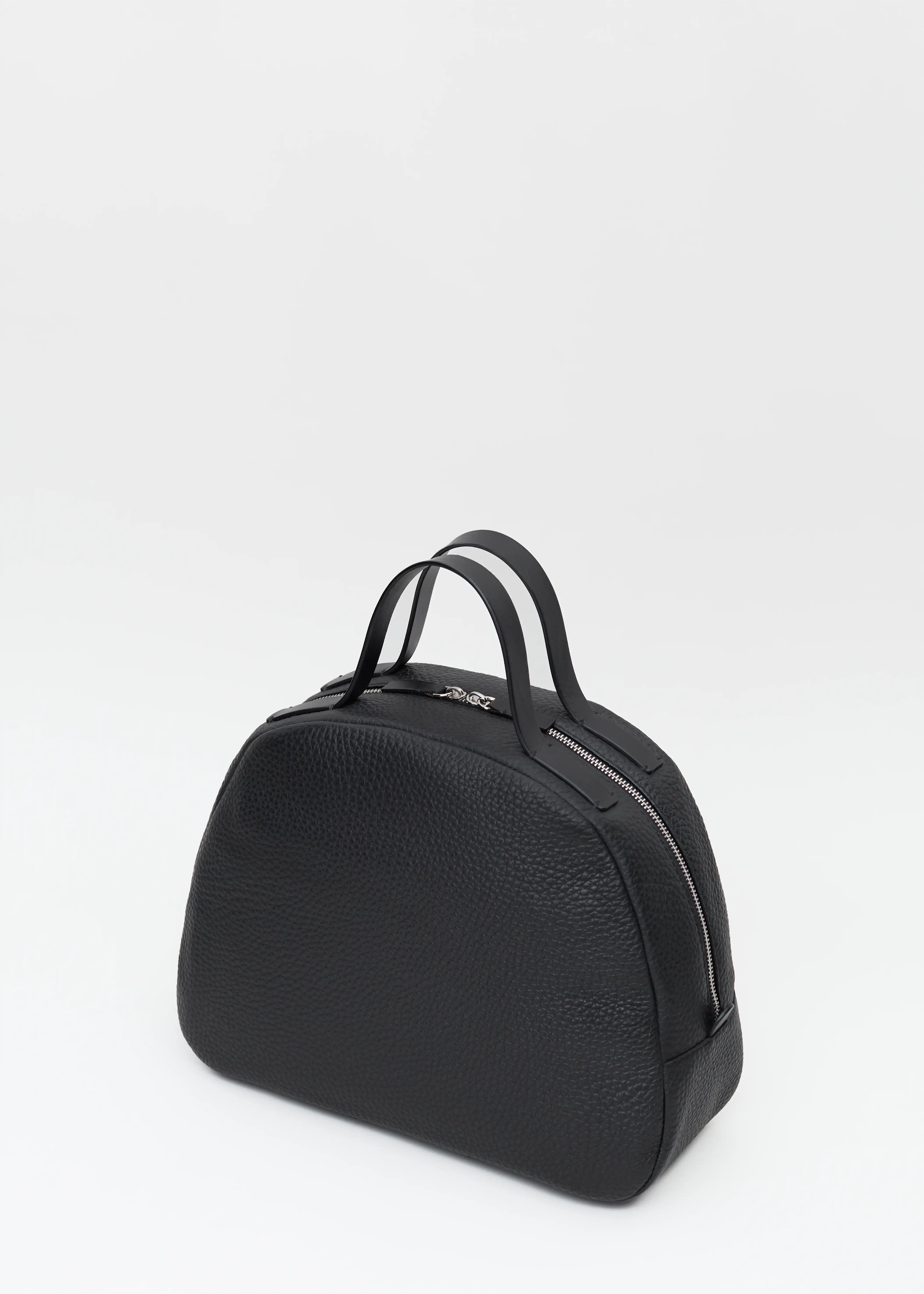Back view of the Philini Domi Black Dome Handbag, crafted from premium buffalo leather with short handles. This handbag is a timeless accessory with a minimalist style