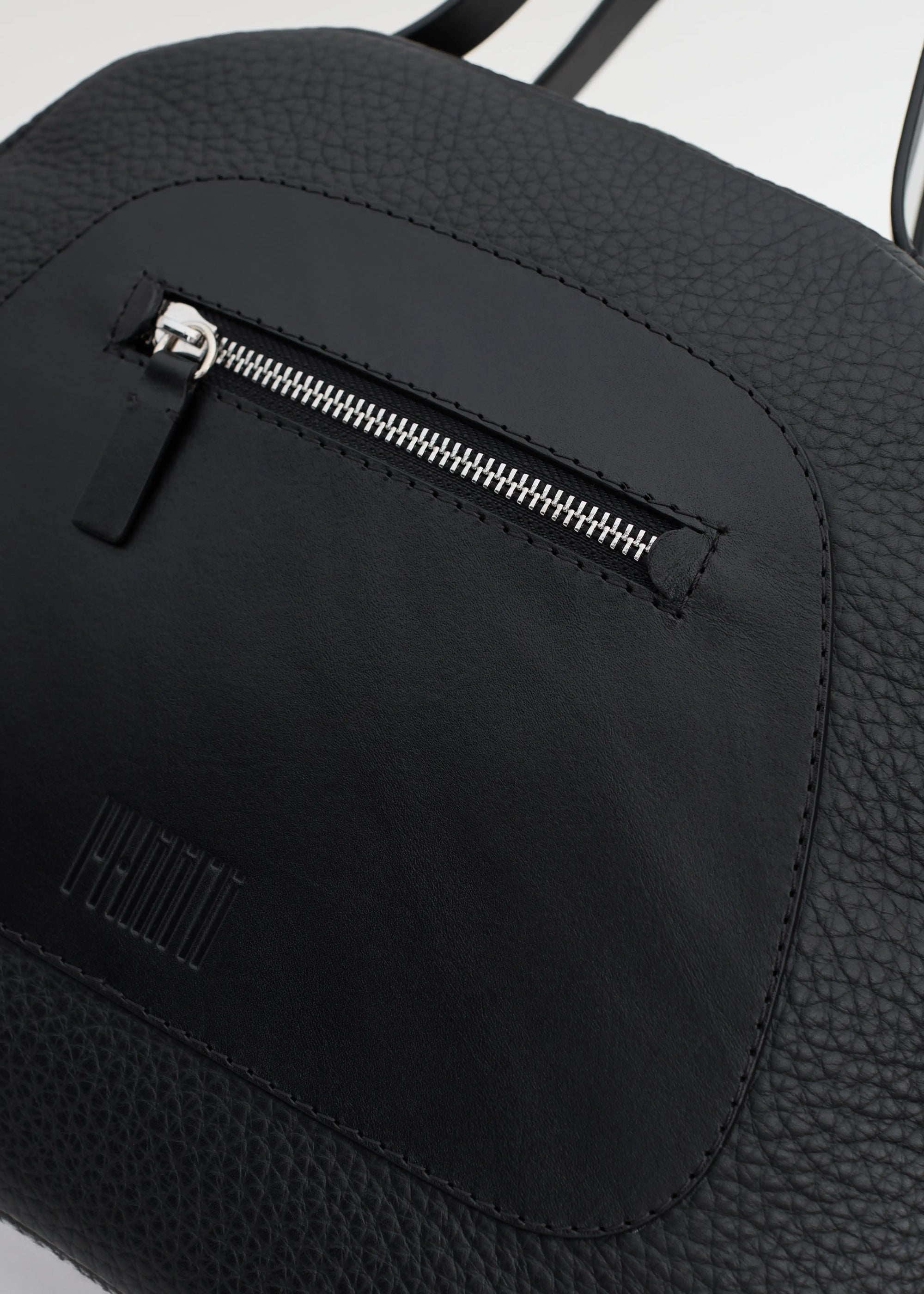 Detailed view of the Philini Domi Black Handbag,  The sustainable, handcrafted luxury leather bag.