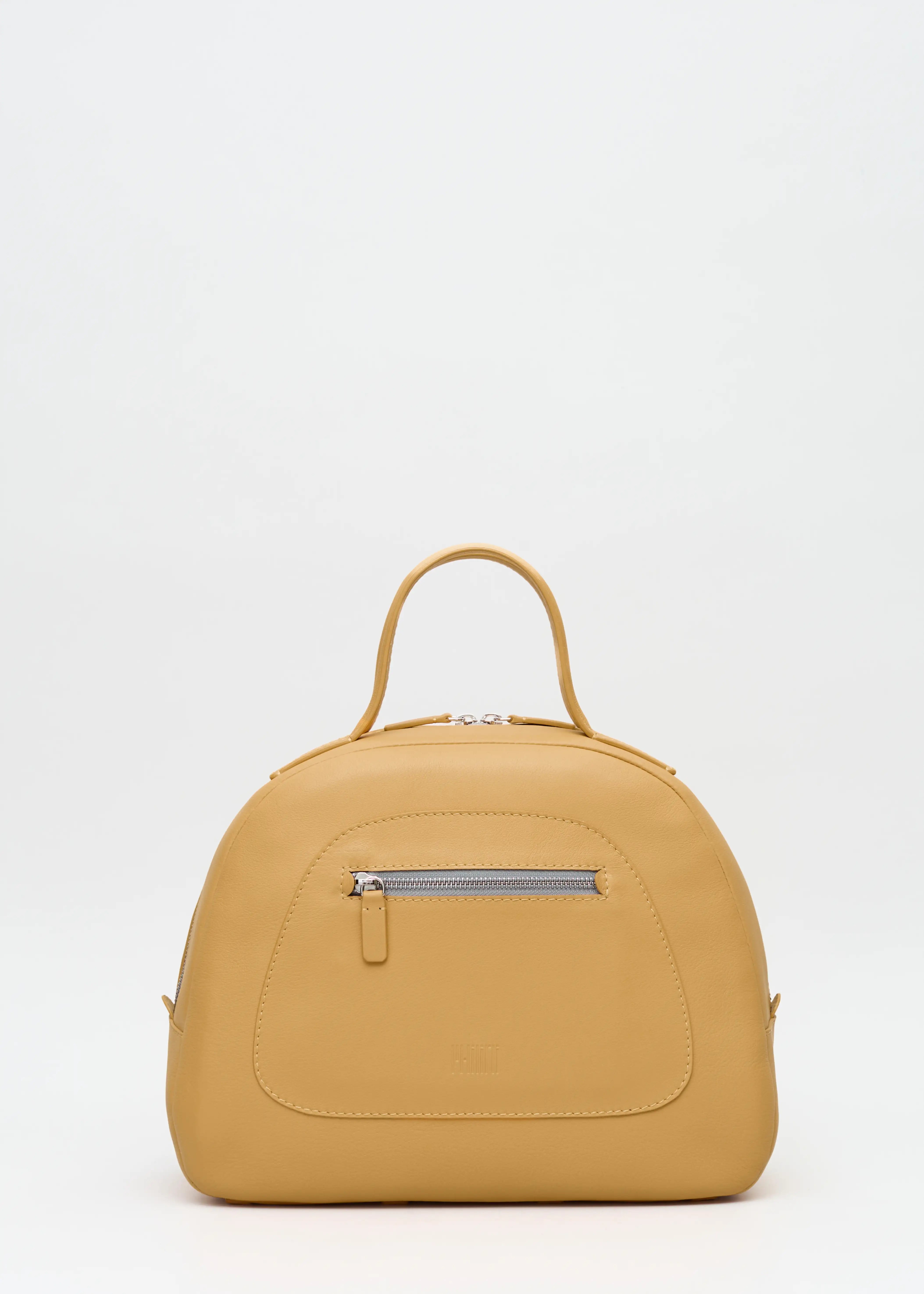 Front view of the yellow Philini Domi Handbag in soft nappa leather, showing dome shape, short handles, front zip pocket, and silver hardware. A stylish and handcrafted everyday leather bag 