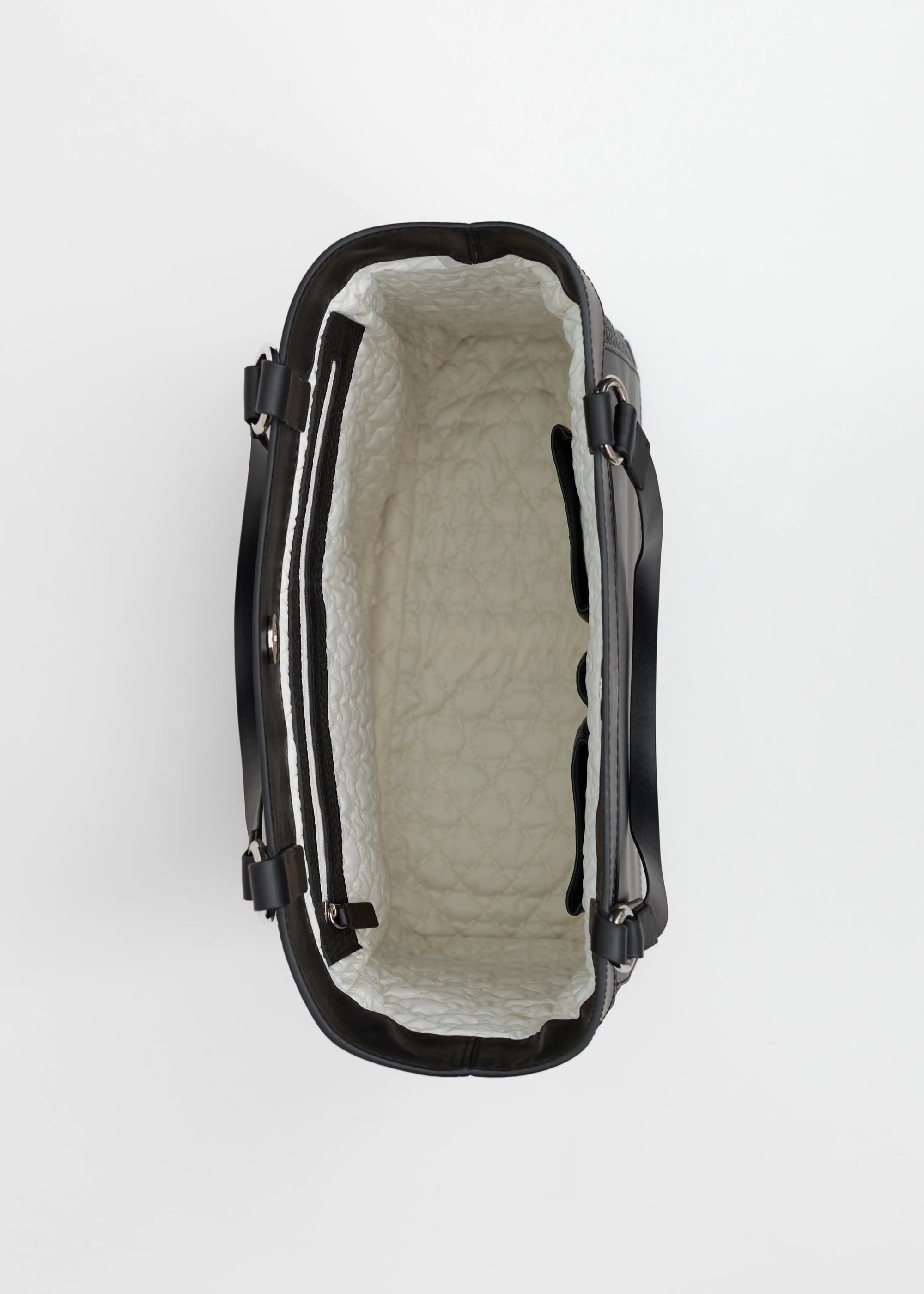 Interior view of the Philini Elena Black Tote Bag, deep zipped pocket with vanilla-coloured lining and two leather compartments for mobile phones and pens, made of high-quality leather