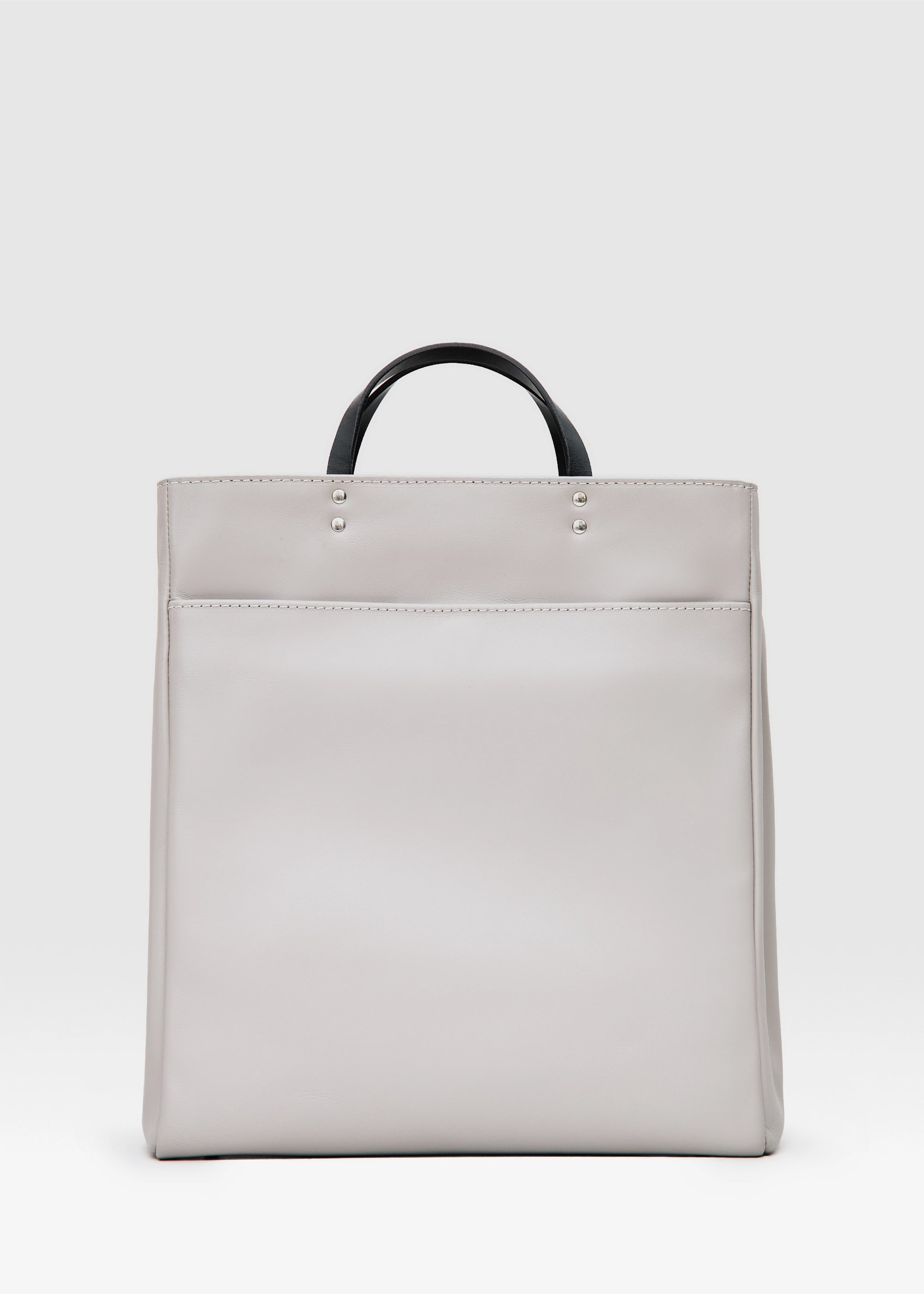 Back view of the Philini Kathy Taupe Business Bag in aniline calf leather with flat handles and front flap pocket